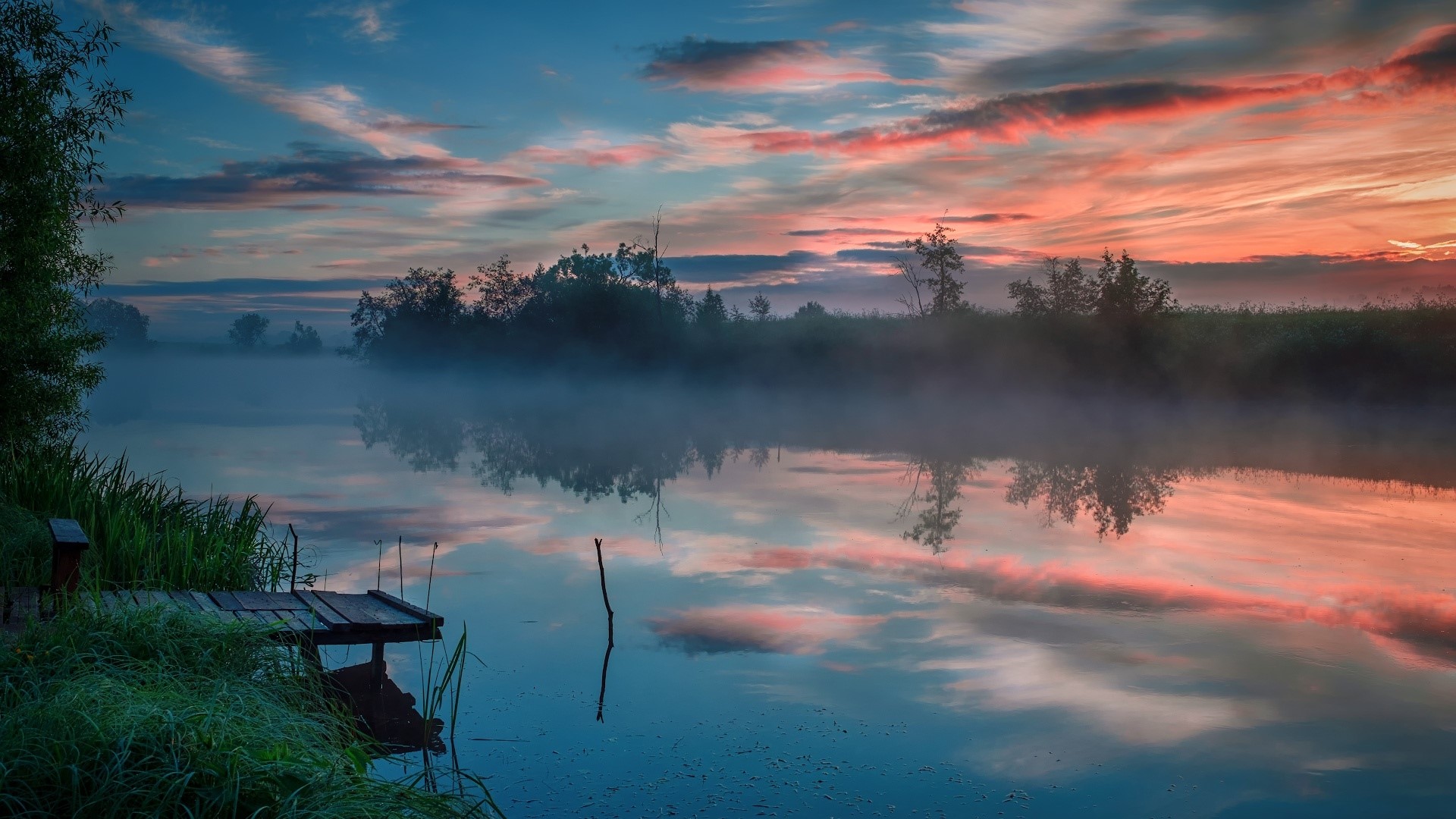 Misty river at sunset with colorful clouds and a wooden pier HD Wallpaper
