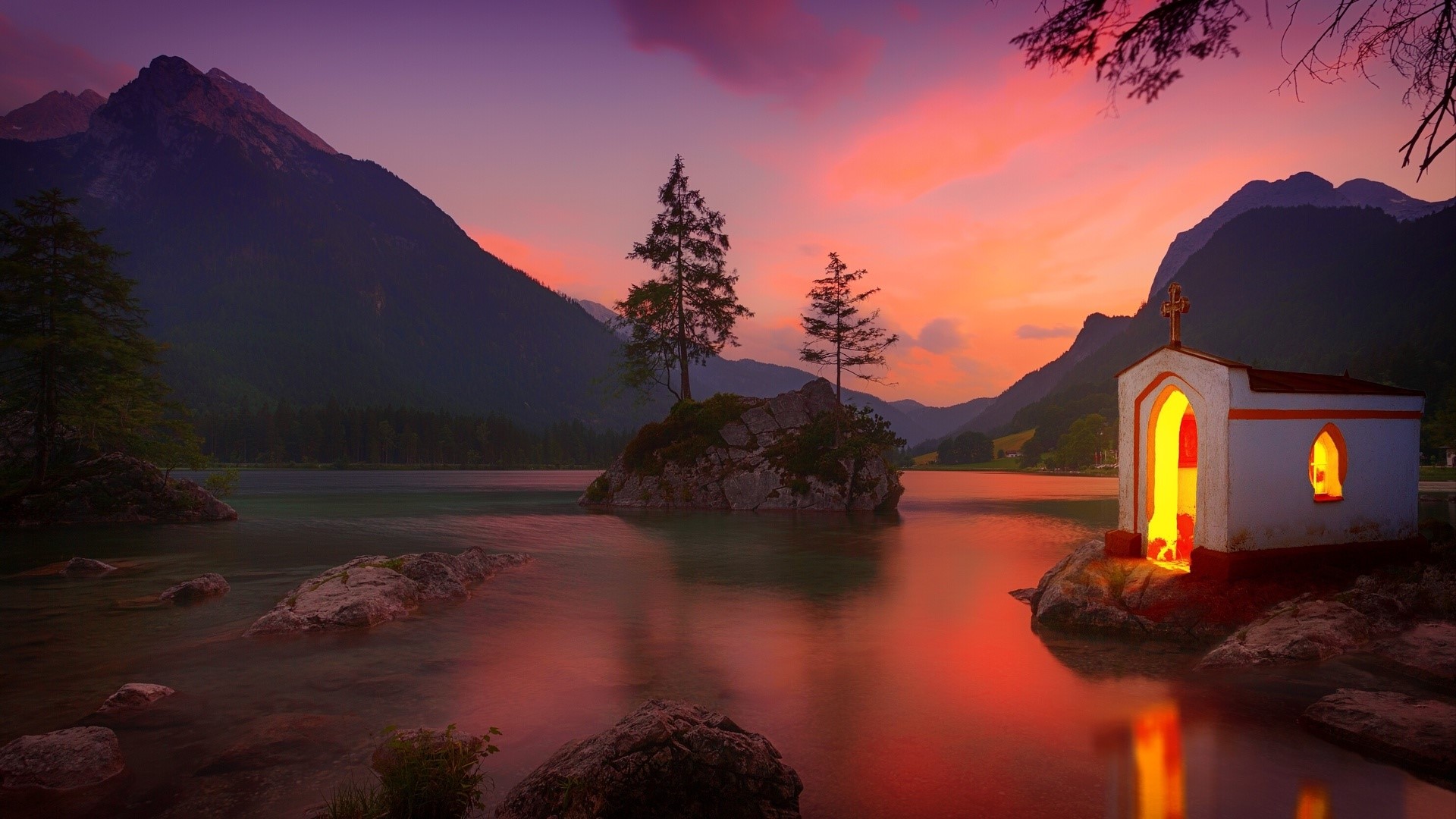 Chapel on a rocky island in a lake at sunset HD Wallpaper