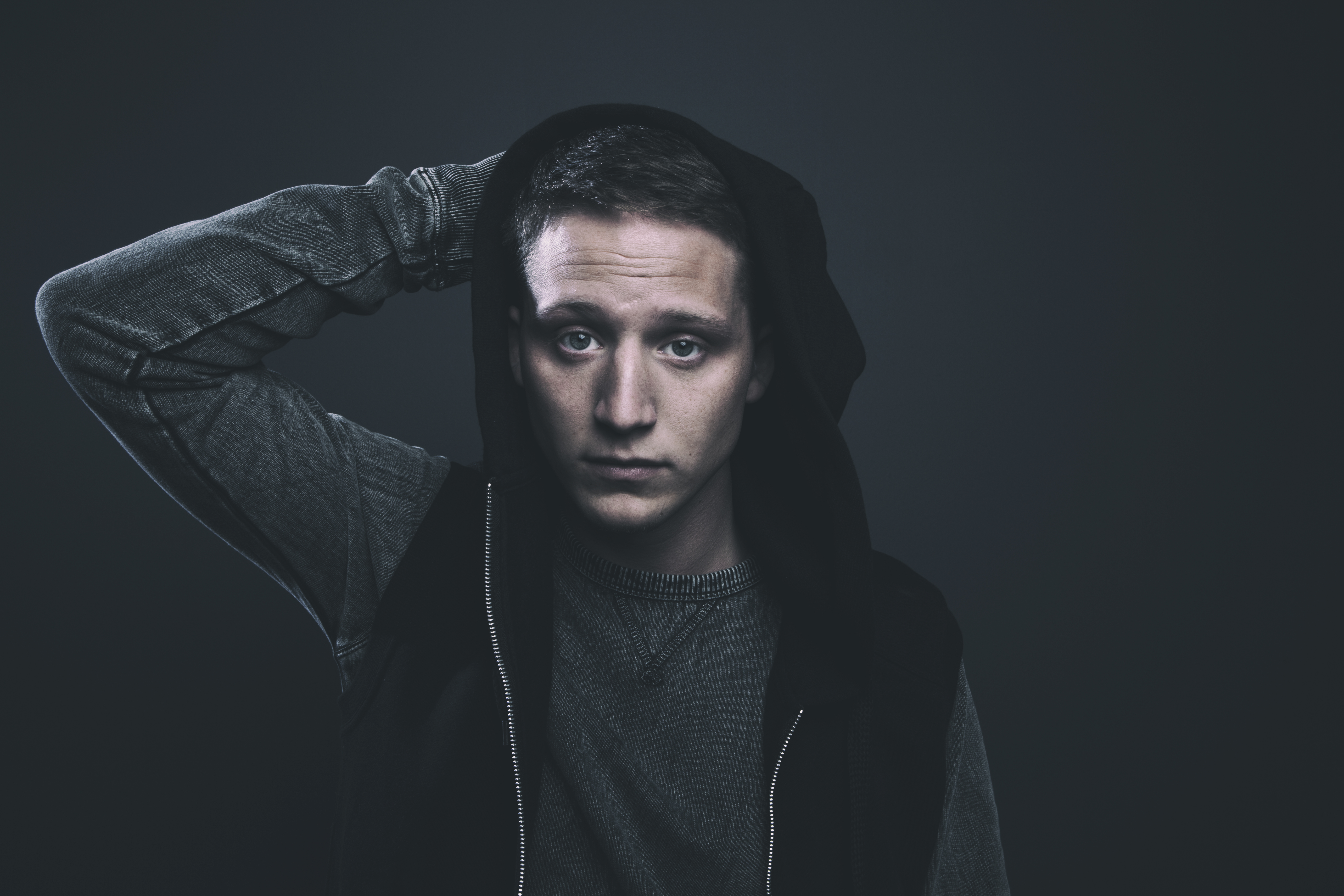 Rapper NF wearing a hoodie HD Wallpaper