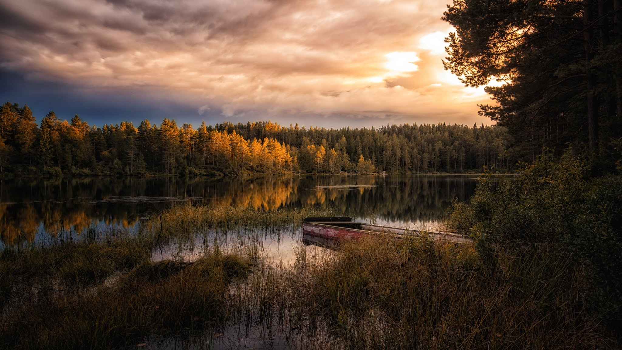 Boat on a lake with autumn trees and sunset clouds HD Wallpaper