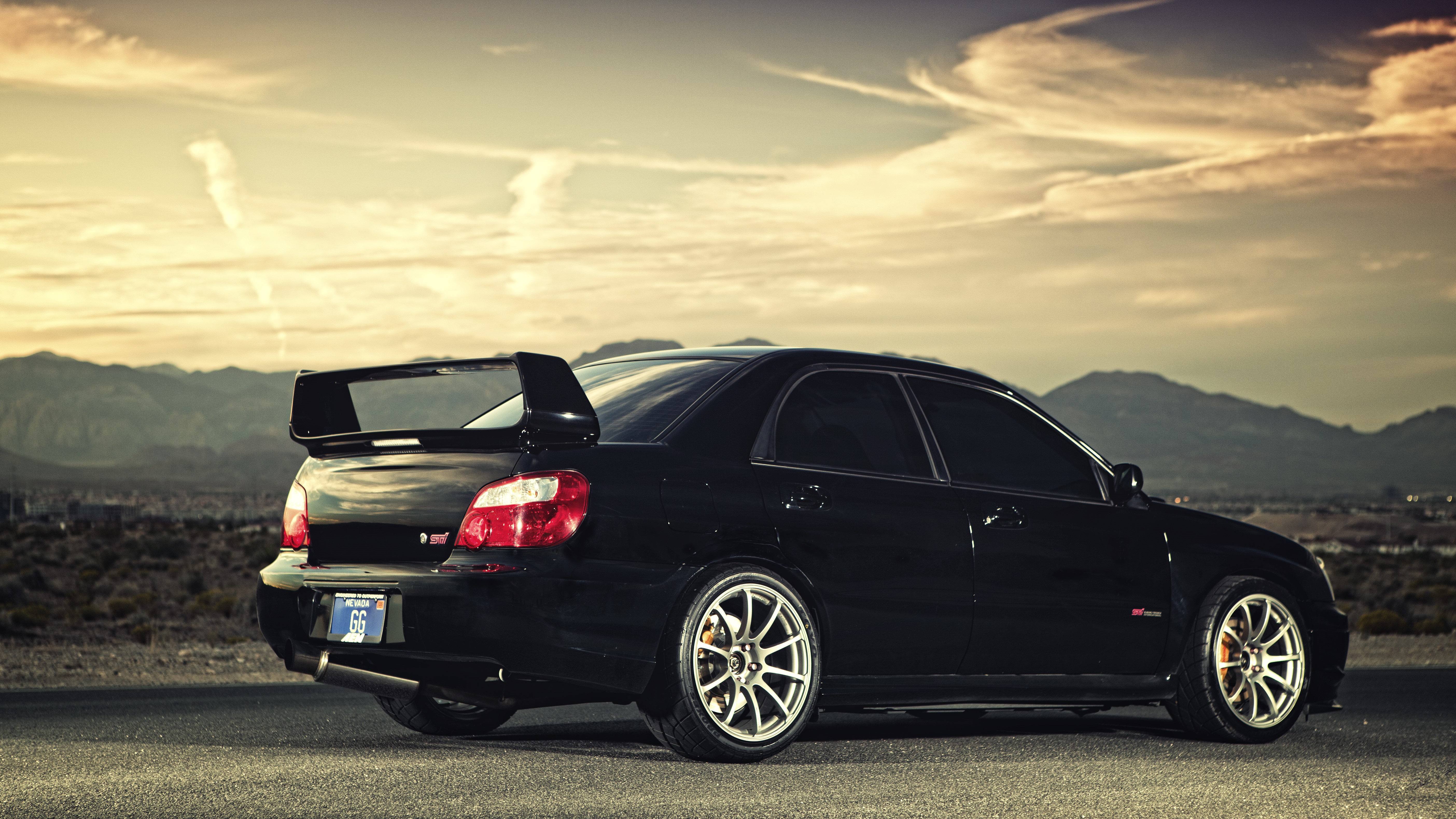 Black Subaru WRX STI in desert landscape HD Wallpaper