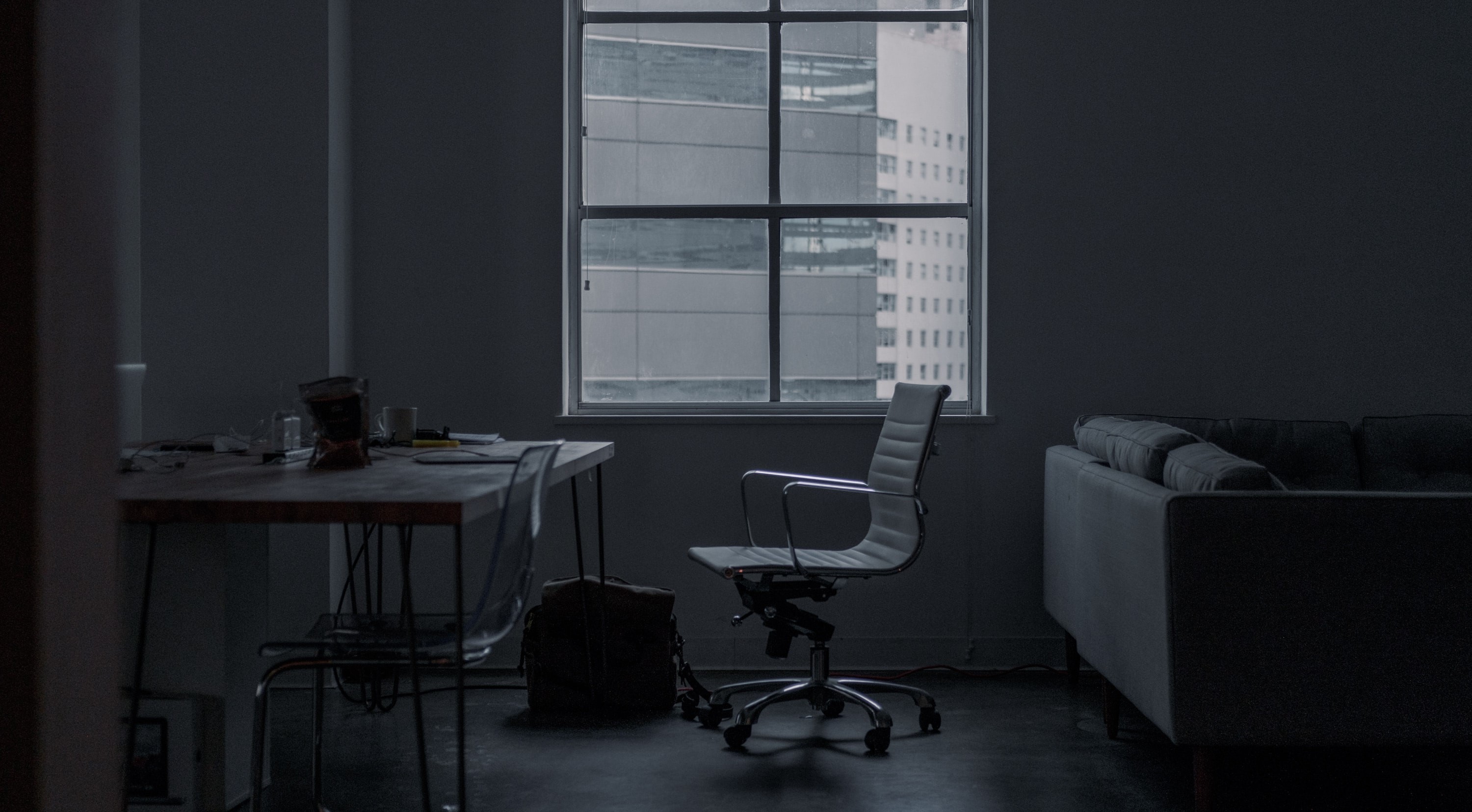 Office interior with desk, chair, and couch HD Wallpaper