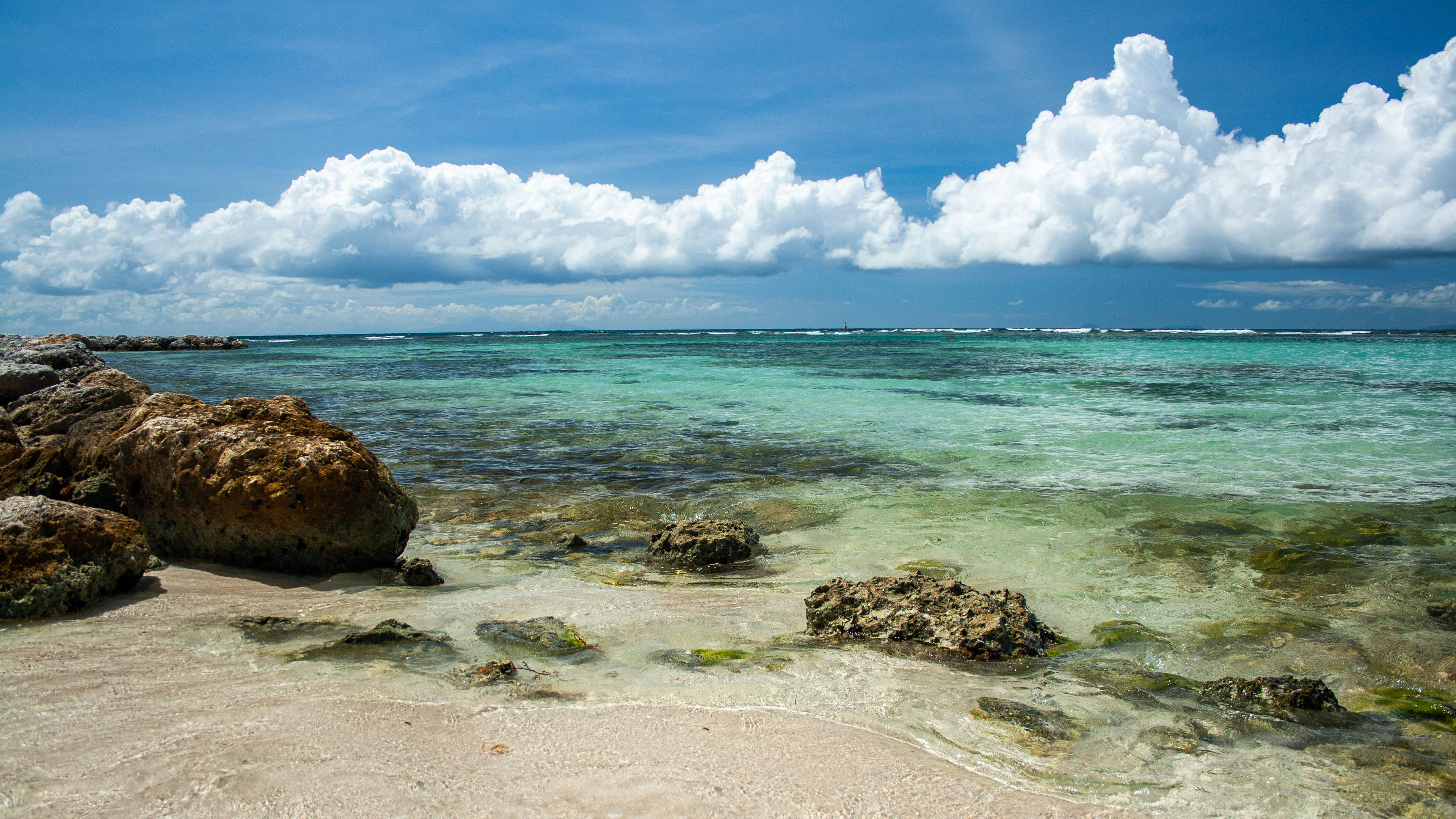 Beach with Rocks and Turquoise Water HD Wallpaper