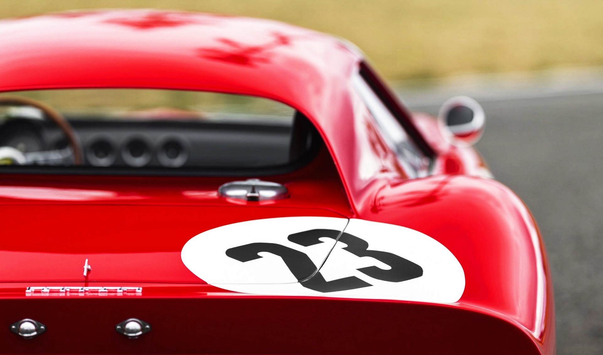 Red Ferrari race car with number 23 HD Wallpaper