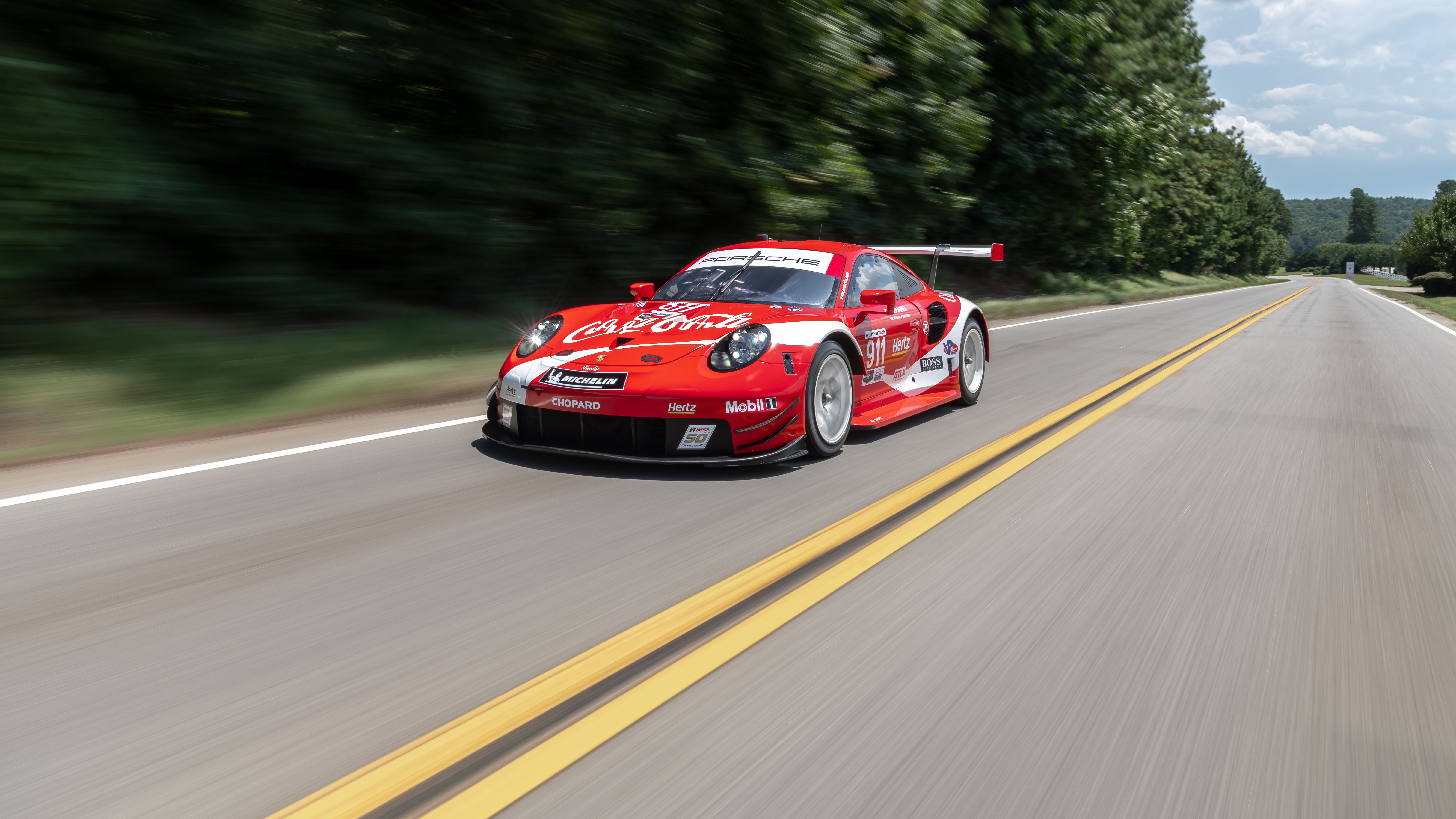 Porsche 911 RSR race car on a road HD Wallpaper