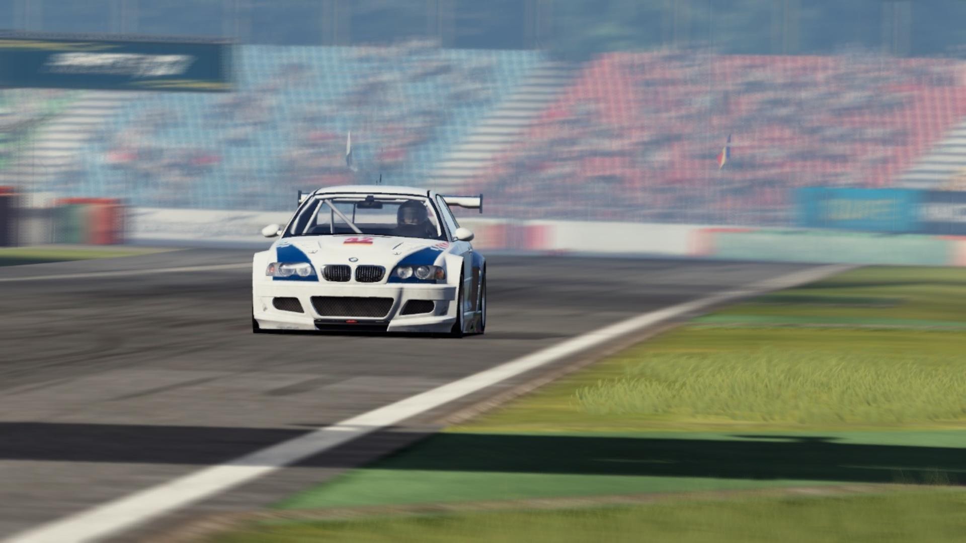 BMW M3 GTR ALMS racing on a track HD Wallpaper