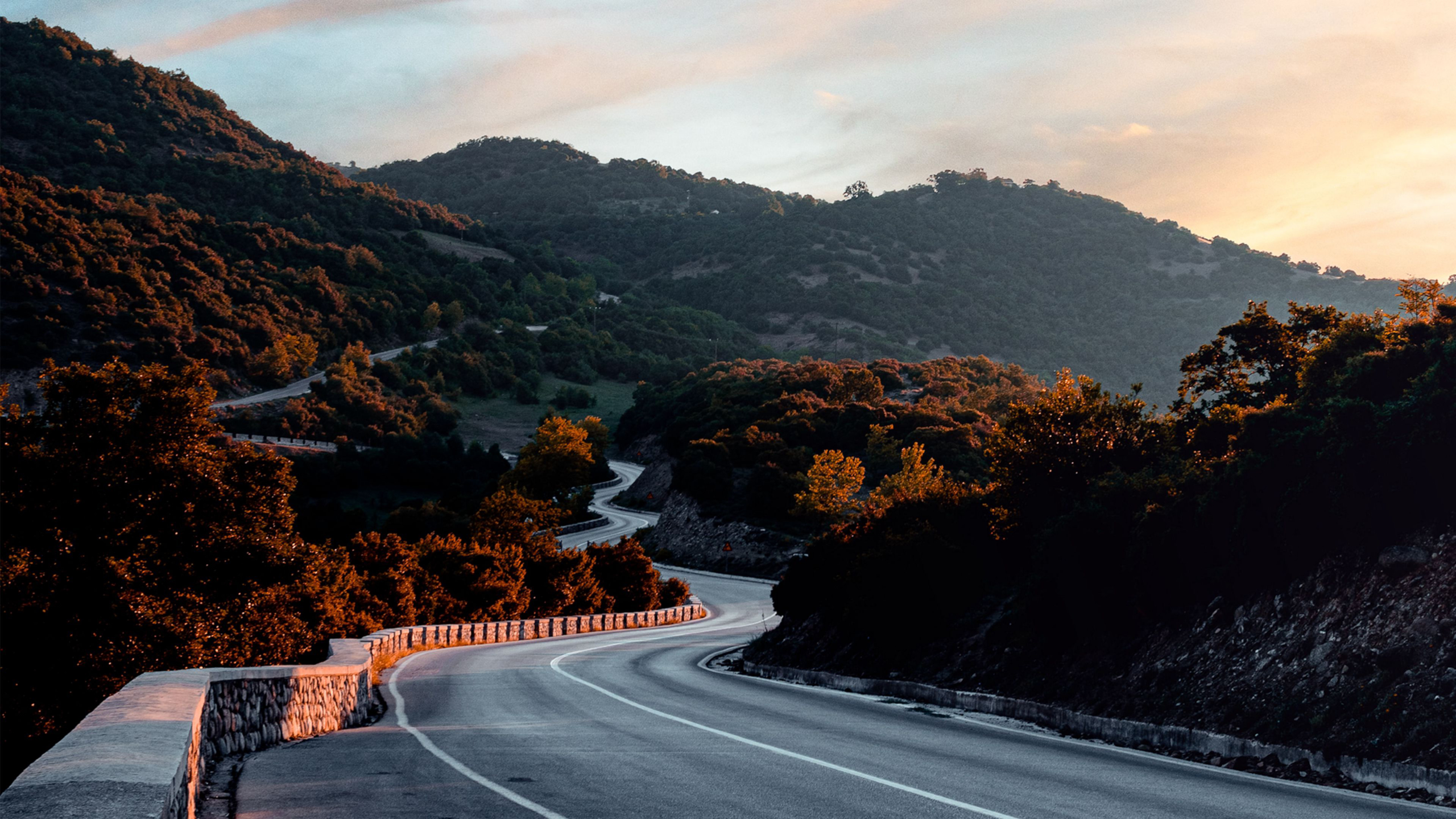 Winding mountain road at sunset HD Wallpaper