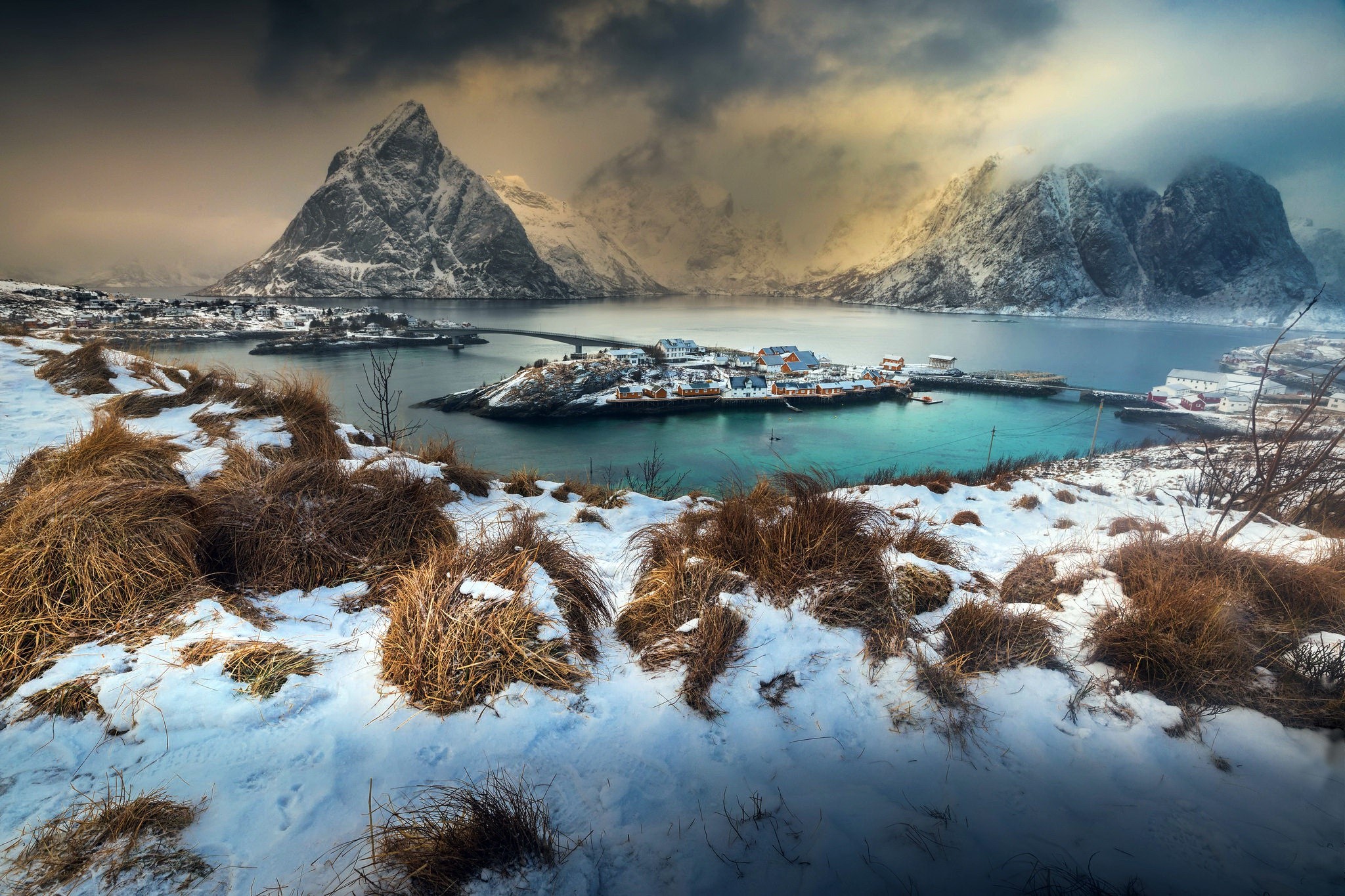 Winter landscape with snow-covered mountains and a village in Norway HD Wallpaper