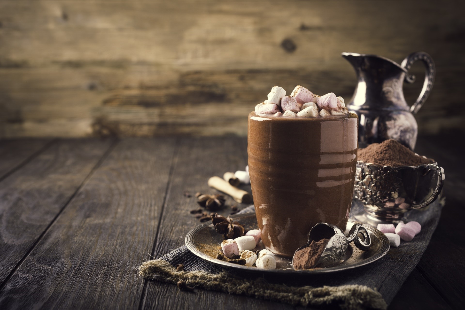 Hot cocoa with marshmallows and chocolate on a wooden surface HD Wallpaper
