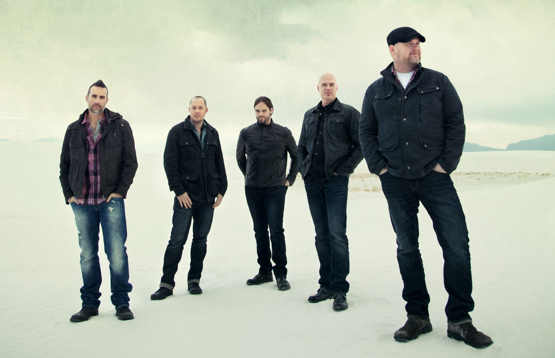 MercyMe band members standing in a desert landscape HD Wallpaper