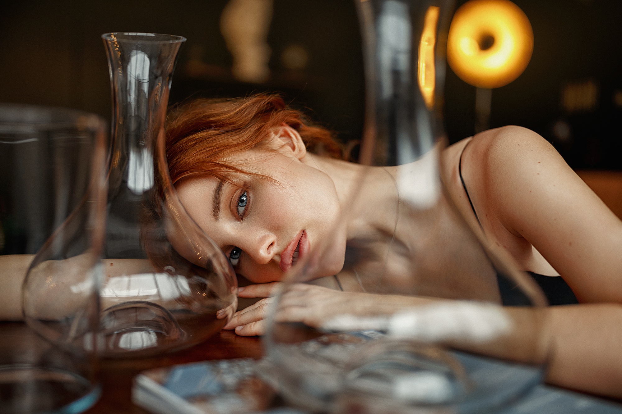 Red-haired woman with blue eyes lying down HD Wallpaper