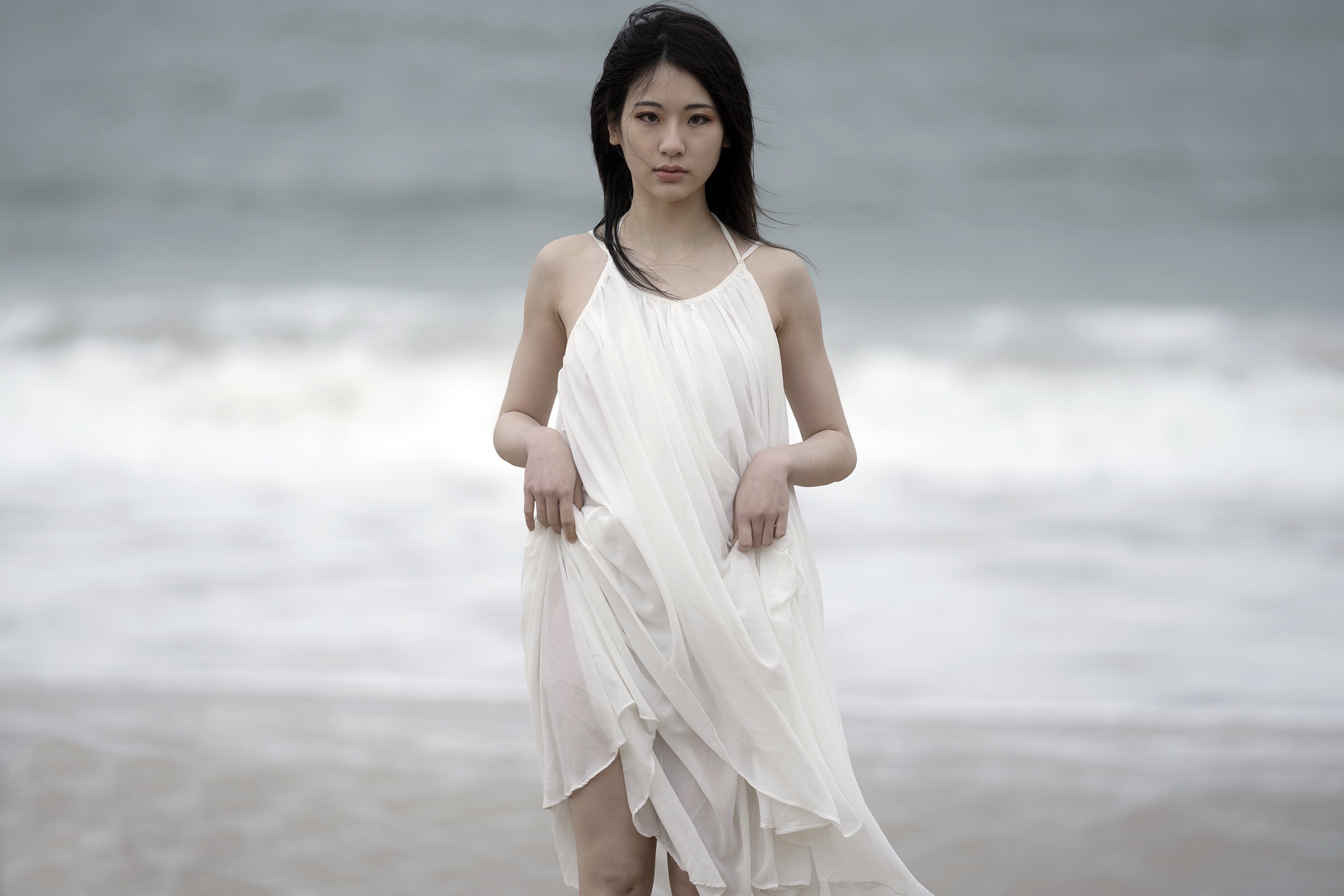 Young Asian woman in white dress on beach HD Wallpaper