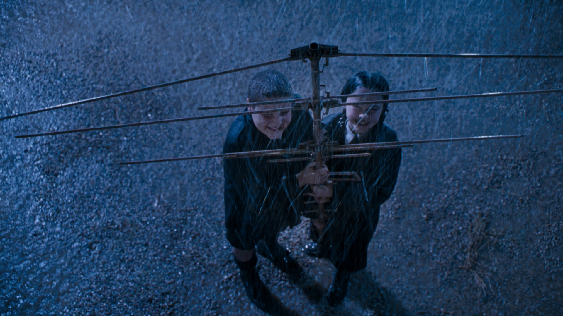 Wednesday and Pugsley Addams holding an antenna HD Wallpaper