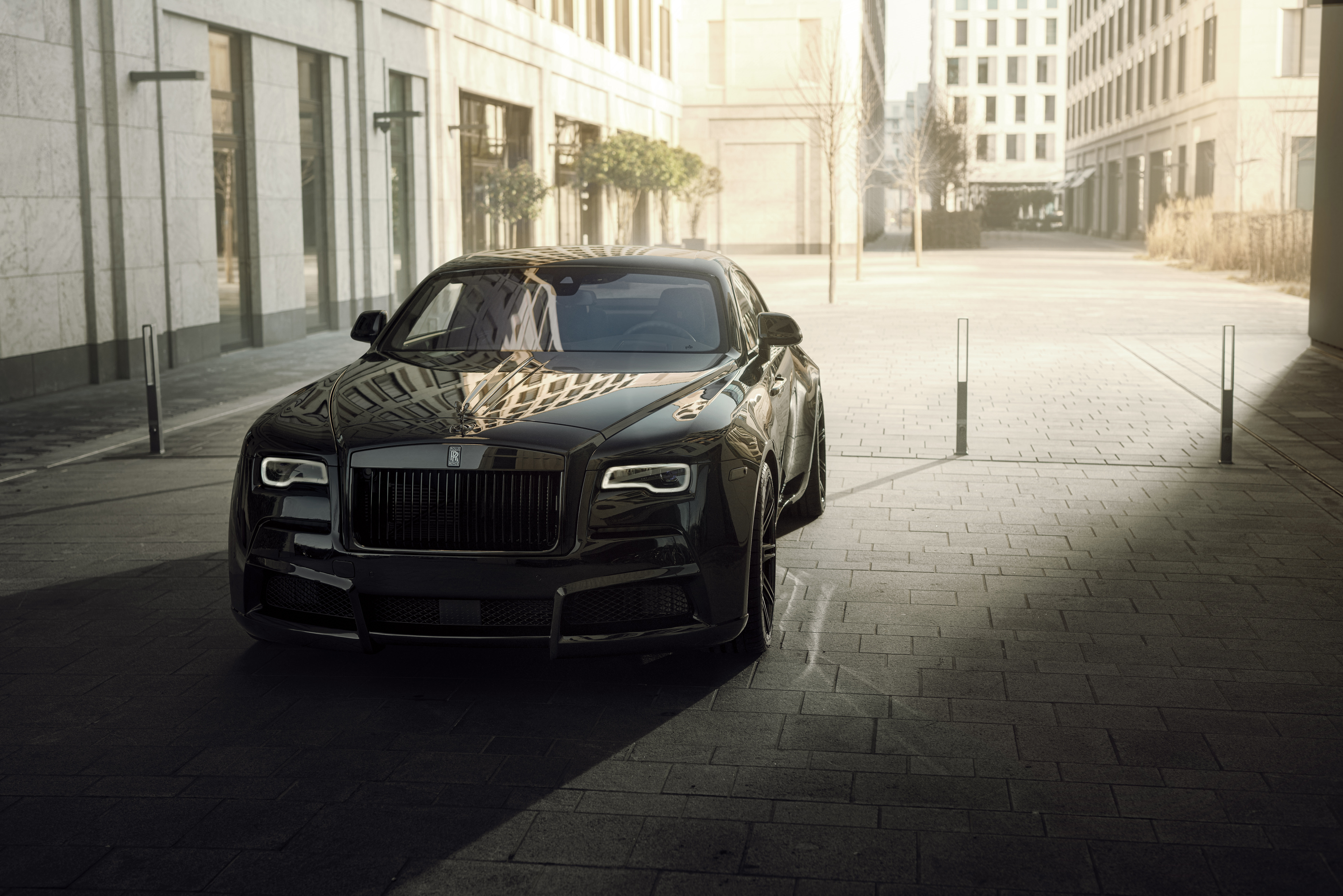 Black Rolls-Royce Wraith parked on a city street HD Wallpaper