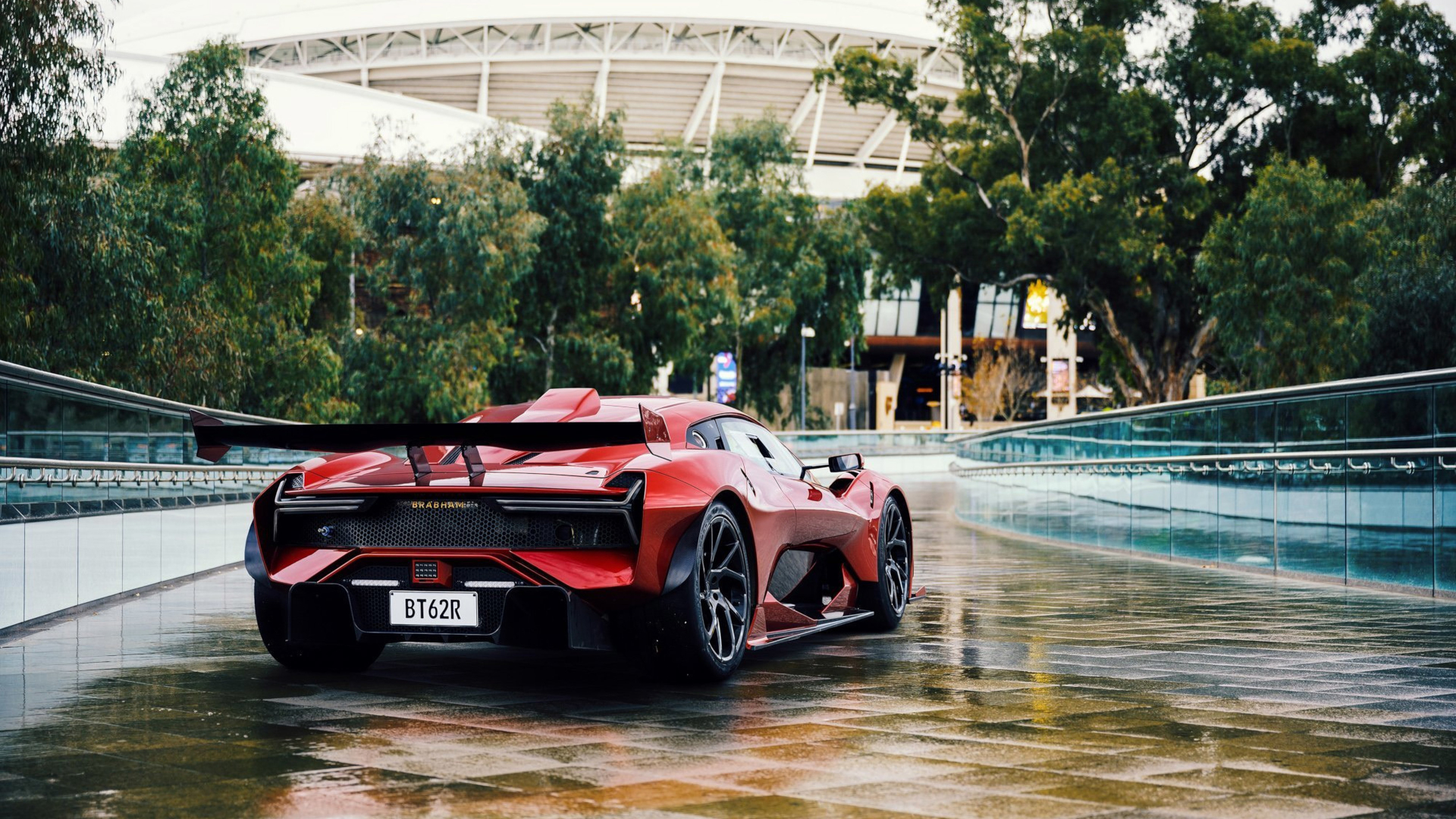 Brabham BT62R sportscar on a wet road HD Wallpaper