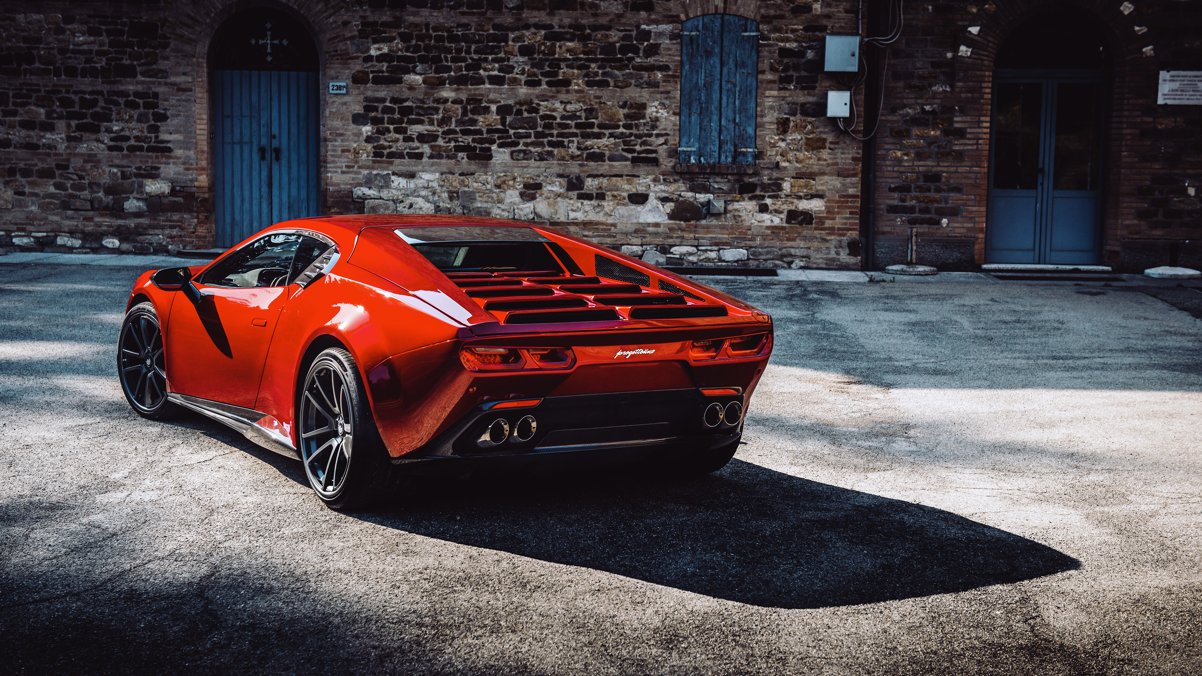 Ares Design Panther ProgettoUno (2021) parked in front of a brick building HD Wallpaper