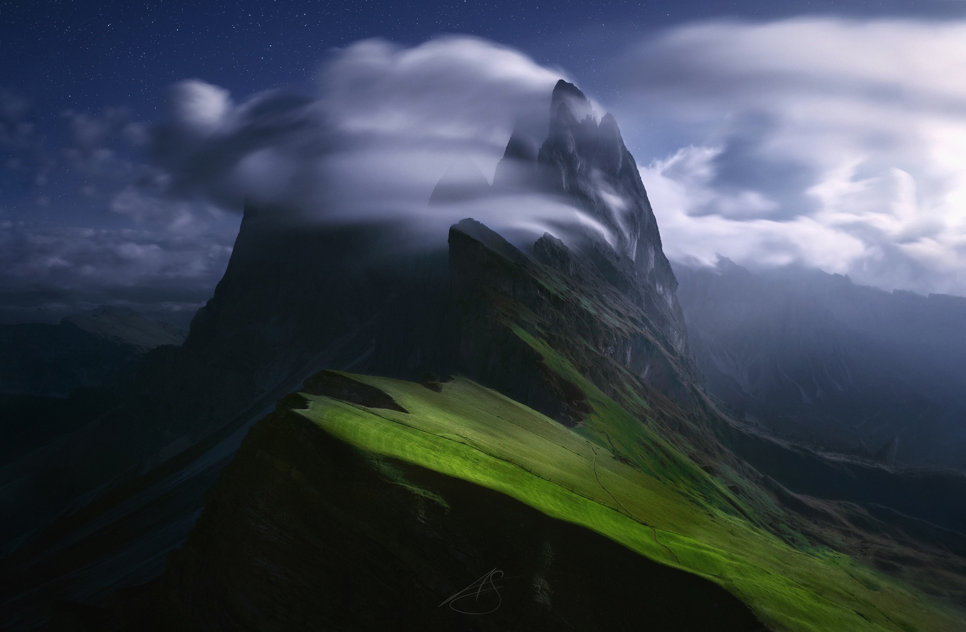Mountain peaks shrouded in clouds under a starry night sky HD Wallpaper