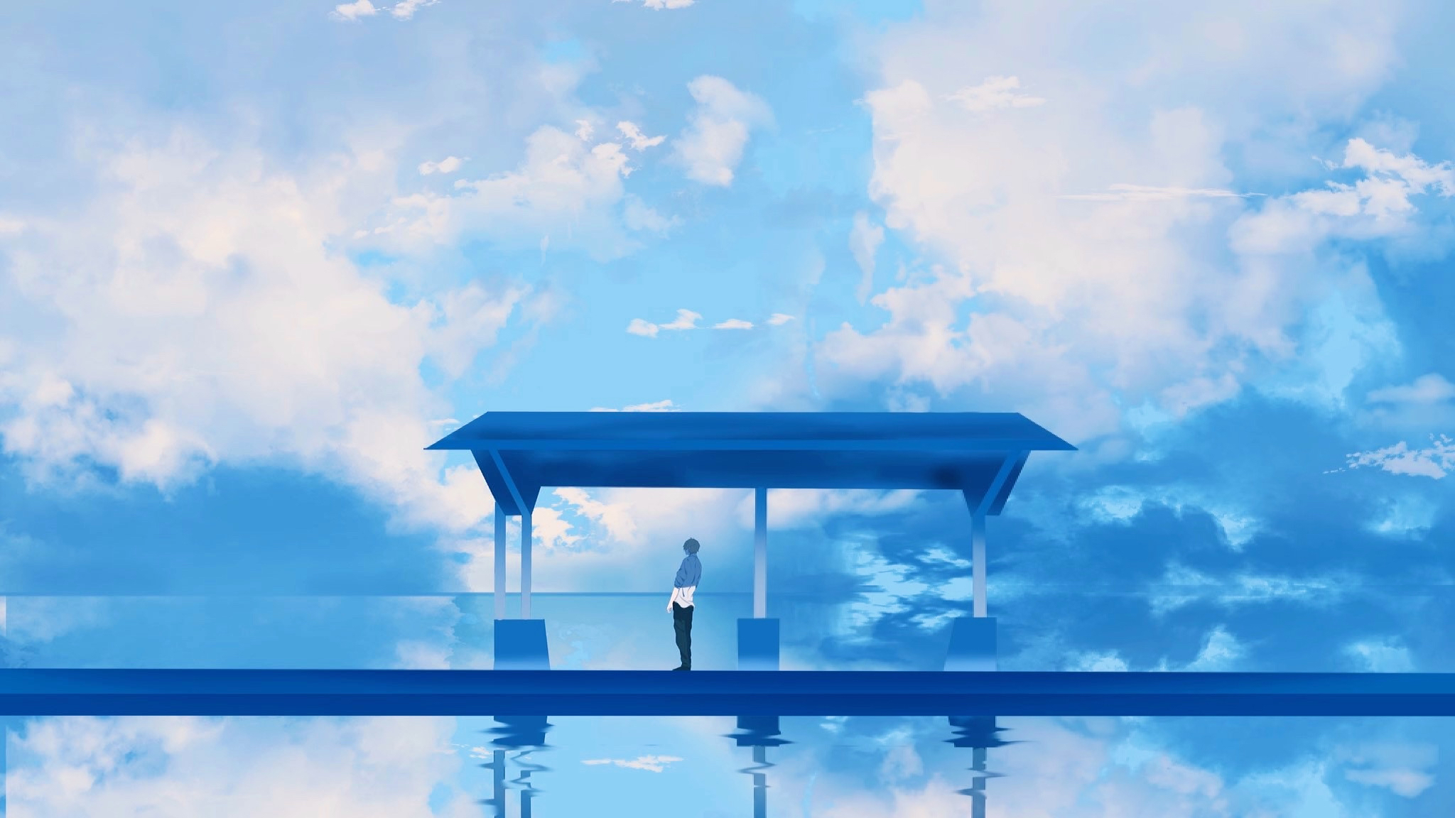 A lone figure stands under a blue shelter by the water HD Wallpaper