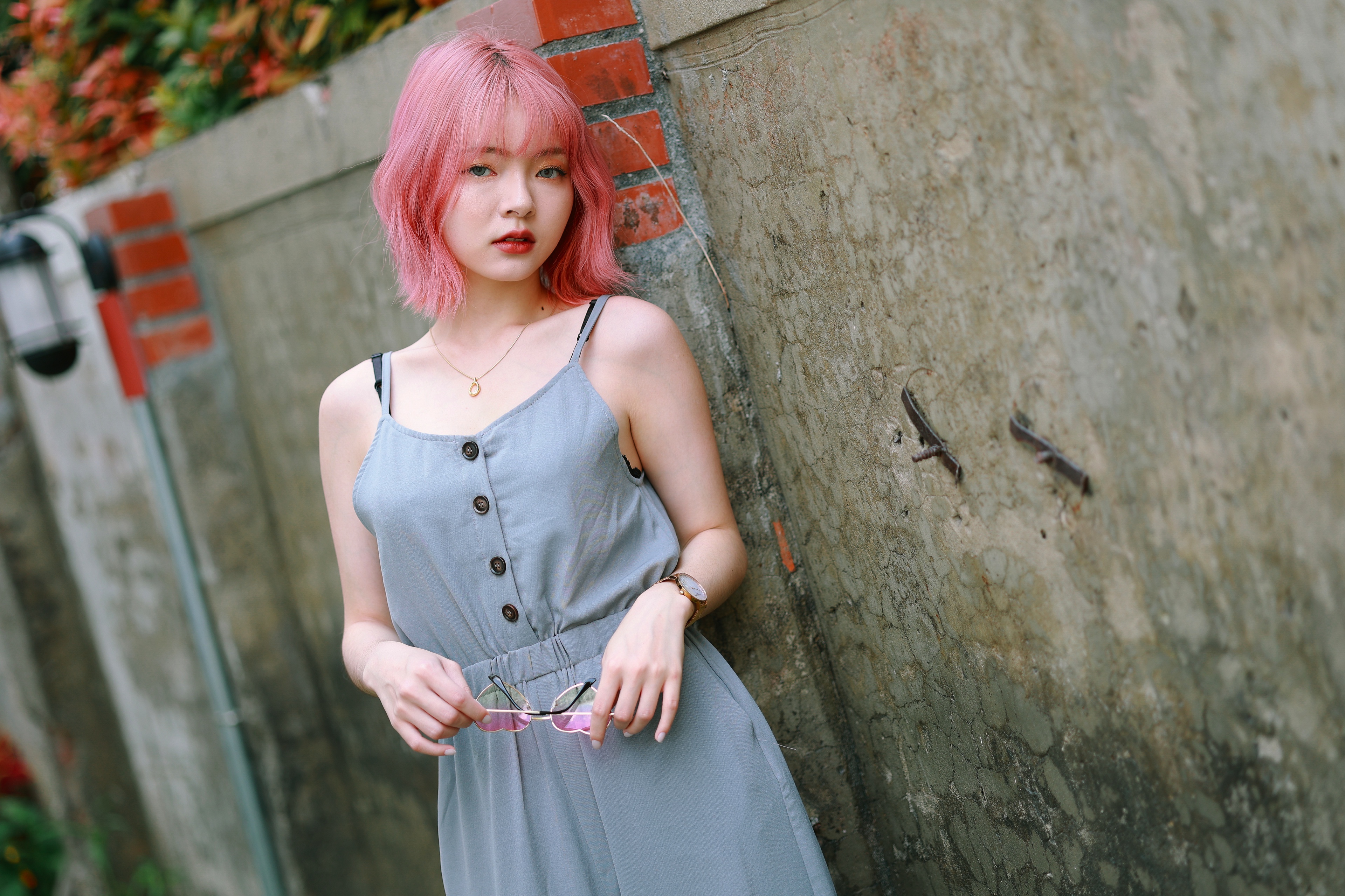 Woman with pink hair wearing a grey jumpsuit HD Wallpaper