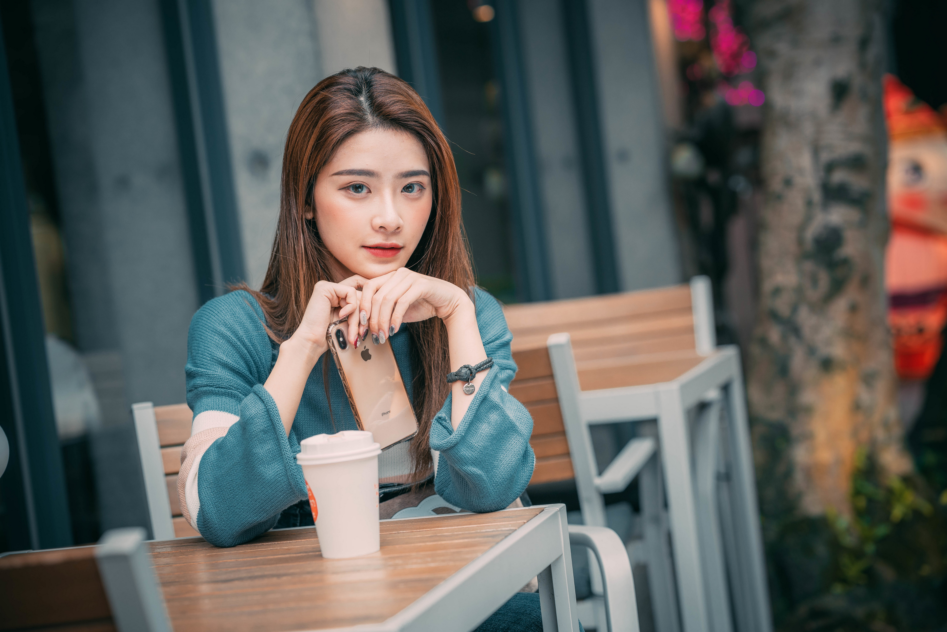 Asian Woman with Brunette Hair Holding Phone HD Wallpaper