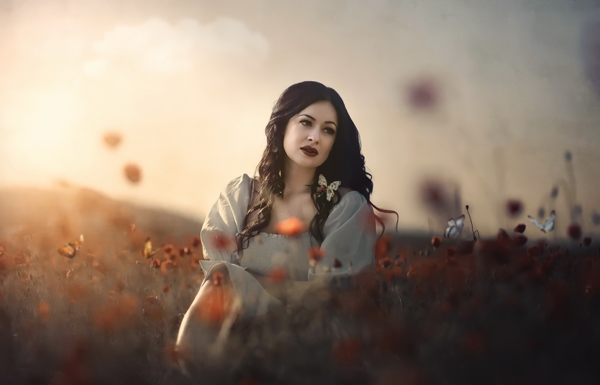 Woman with black hair and lipstick in a field HD Wallpaper