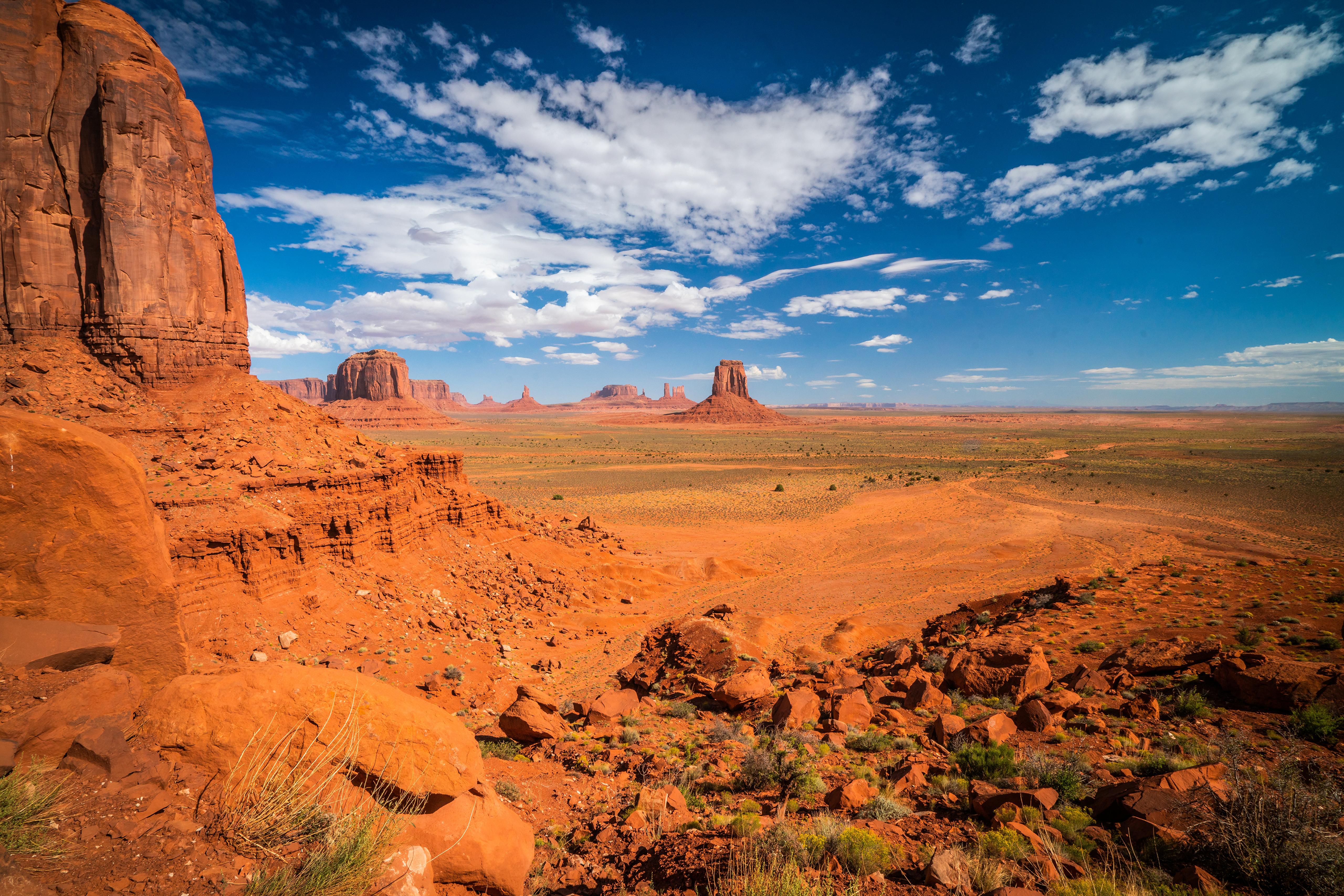 Monument Valley Landscape with Red Rocks and Blue Sky HD Wallpaper