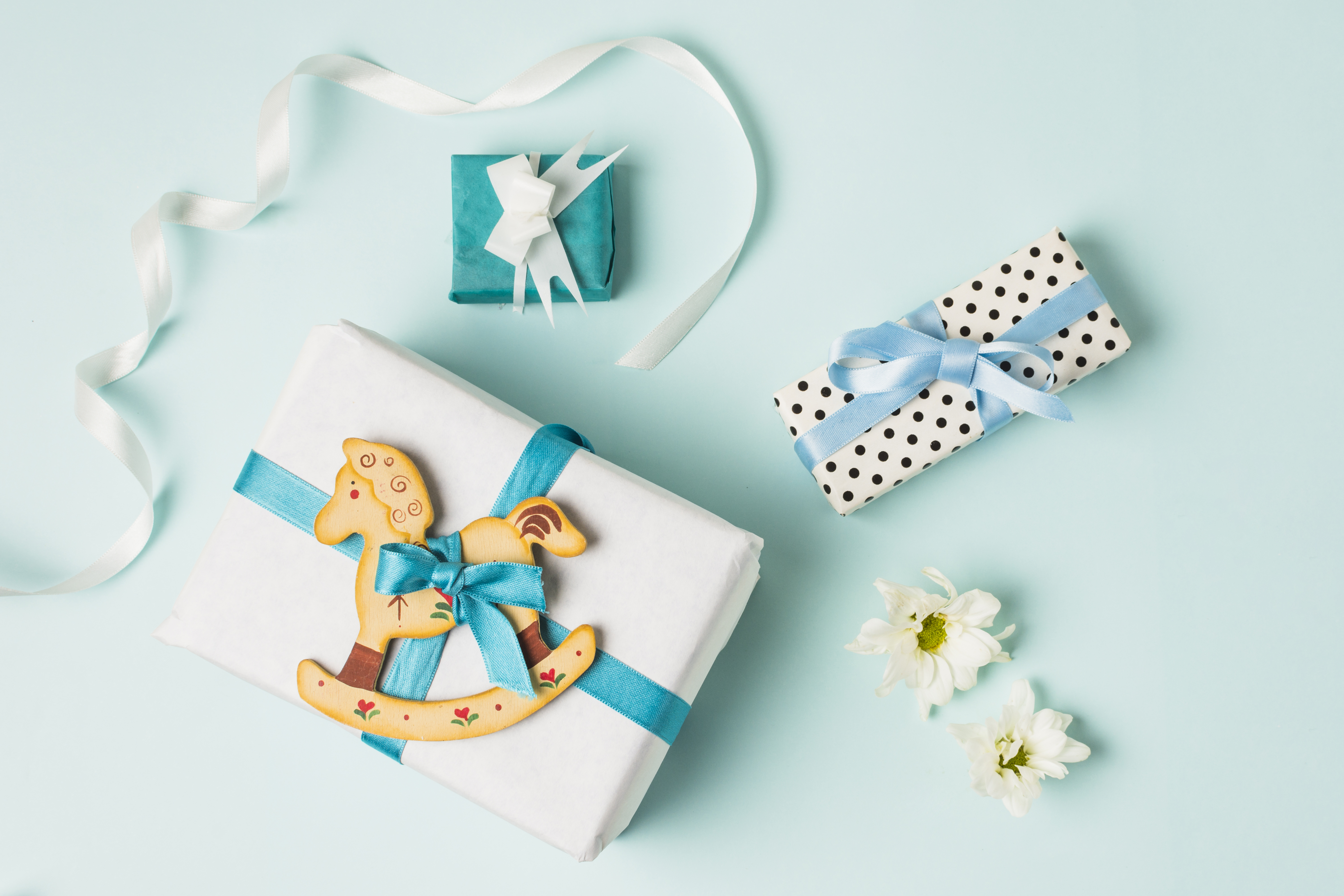 Gifts with rocking horse and flowers HD Wallpaper