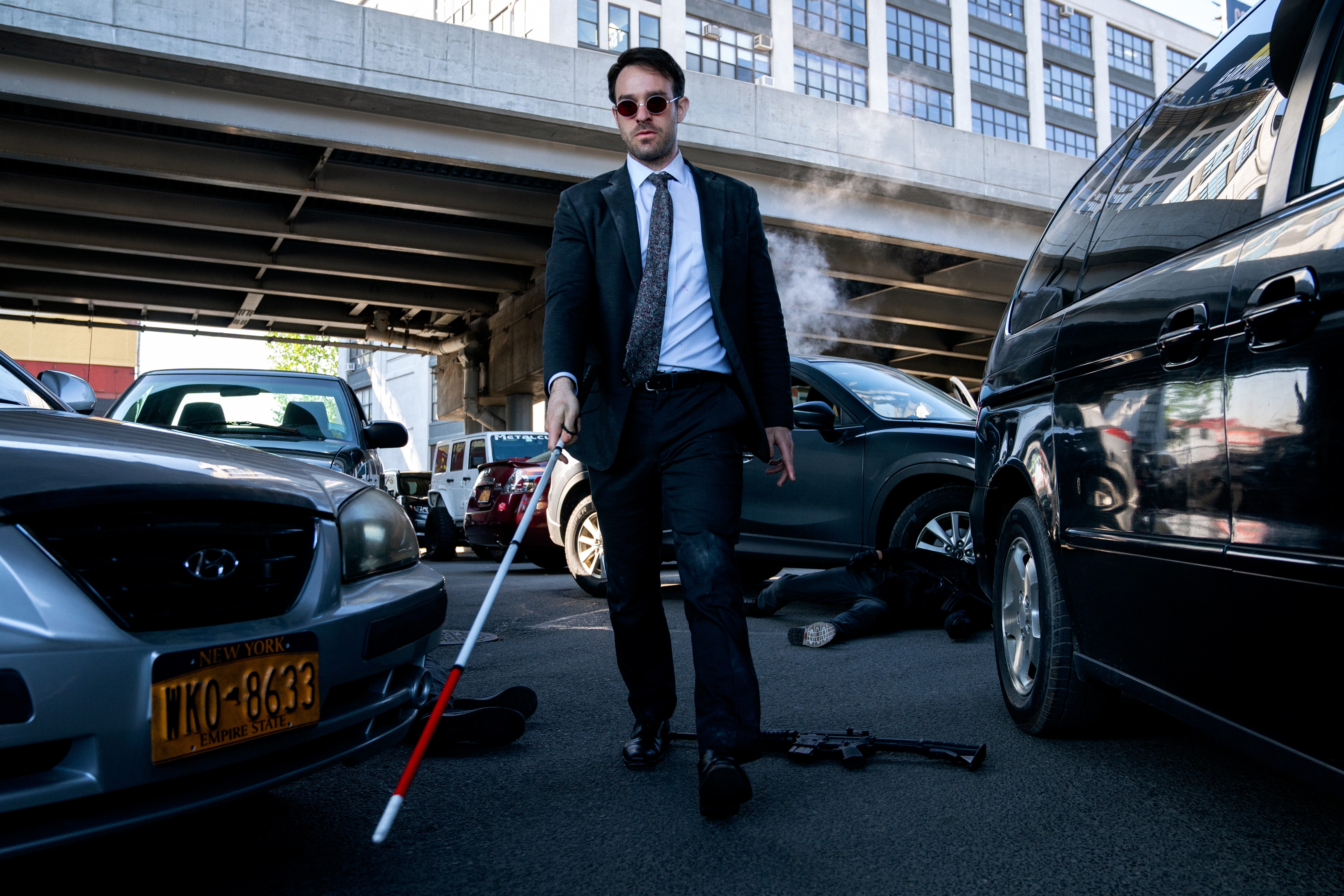 Matt Murdock with a cane on a street HD Wallpaper