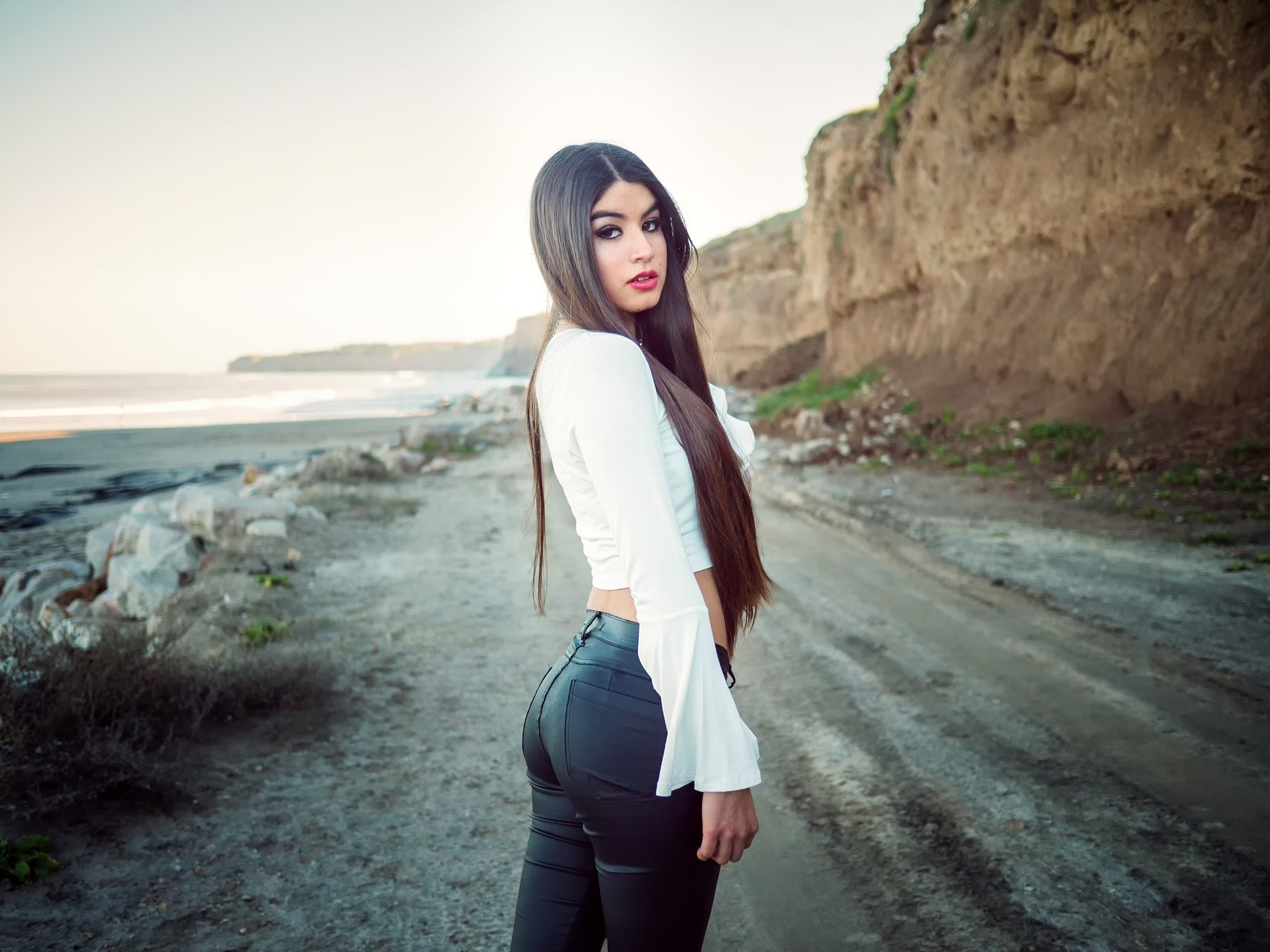 Woman with Long Black Hair Outdoors HD Wallpaper