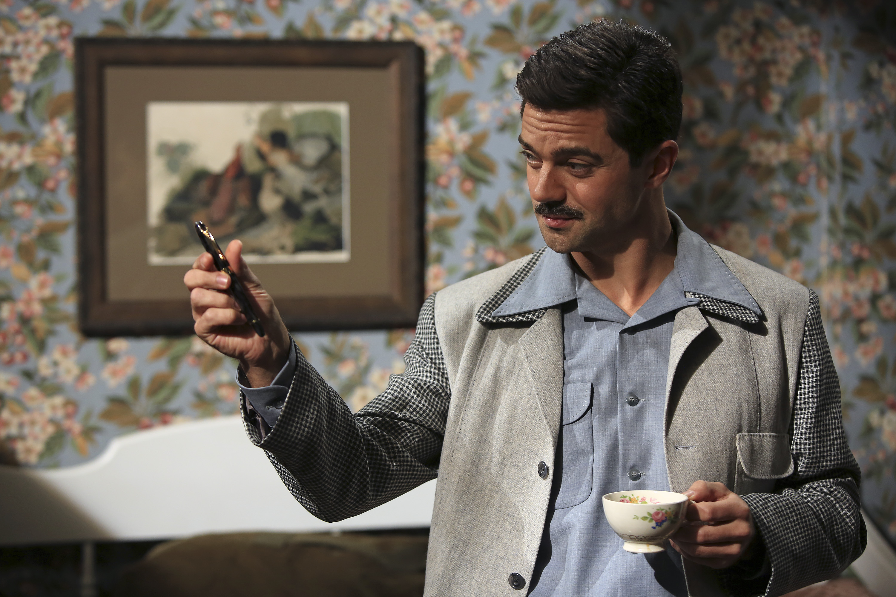 Howard Stark holding a pen and a teacup HD Wallpaper