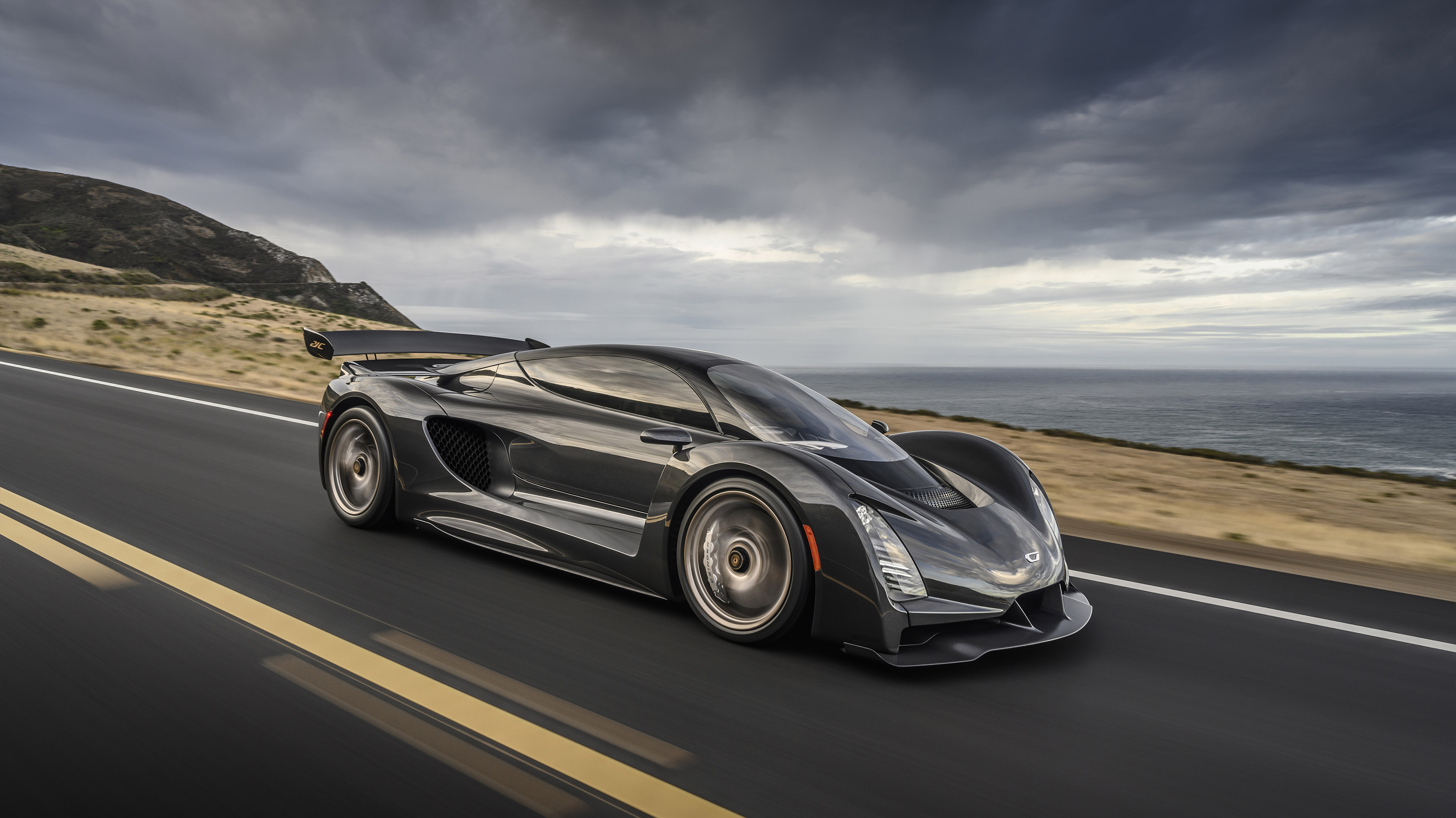 Czinger 21C Supercar driving on coastal road HD Wallpaper