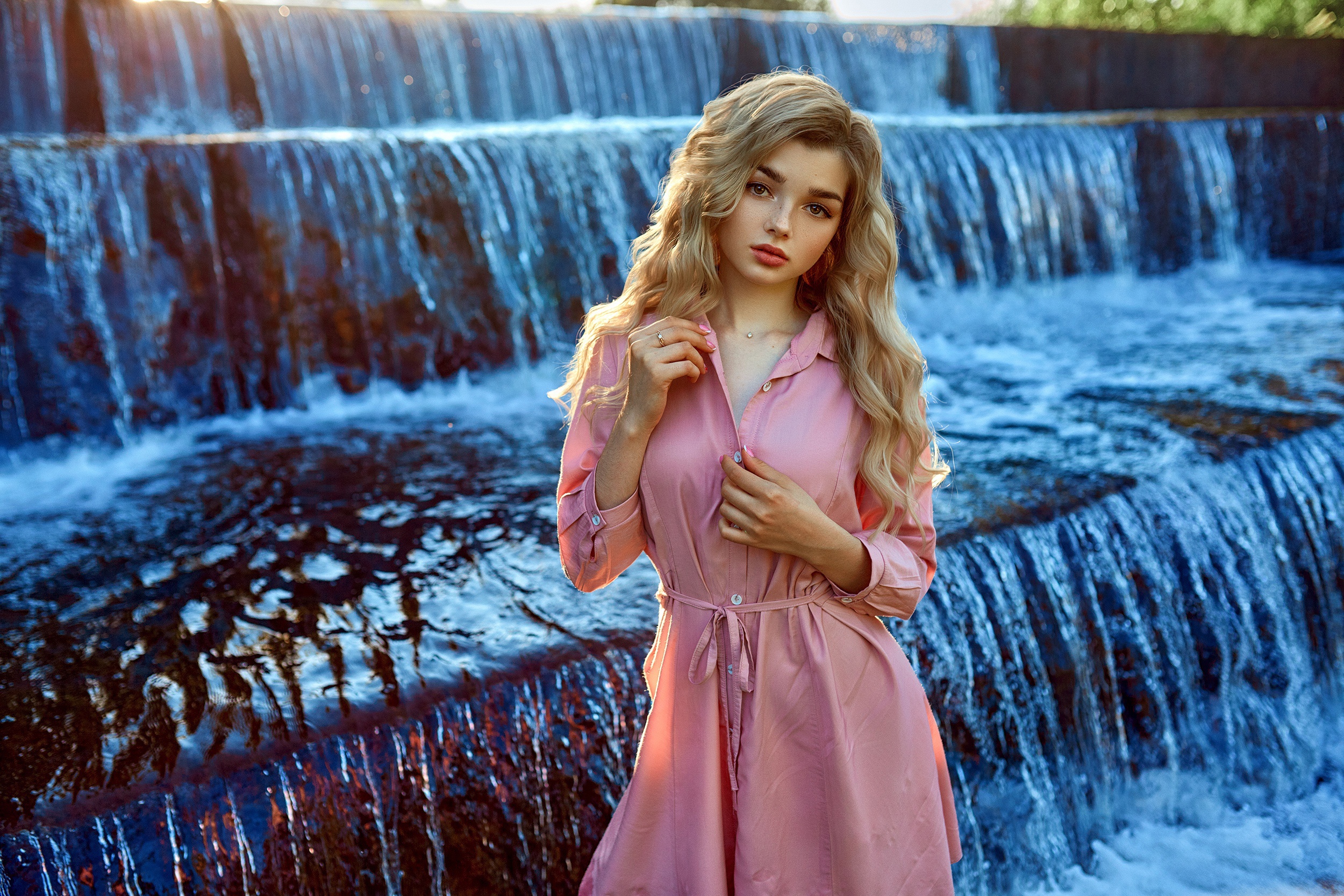 Blonde Woman in Flowing Pink Dress by Waterfall HD Wallpaper