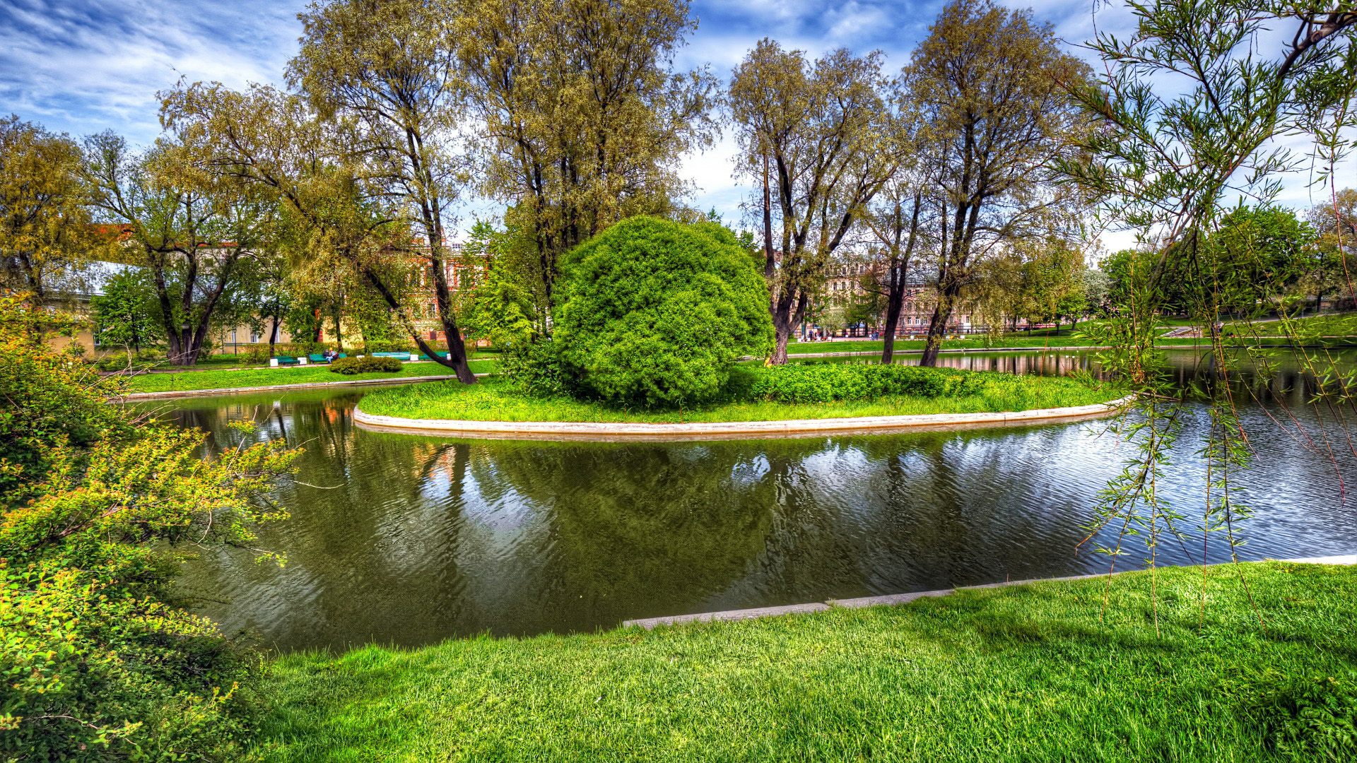 Serene Park with Reflective Pond and Trees HD Wallpaper