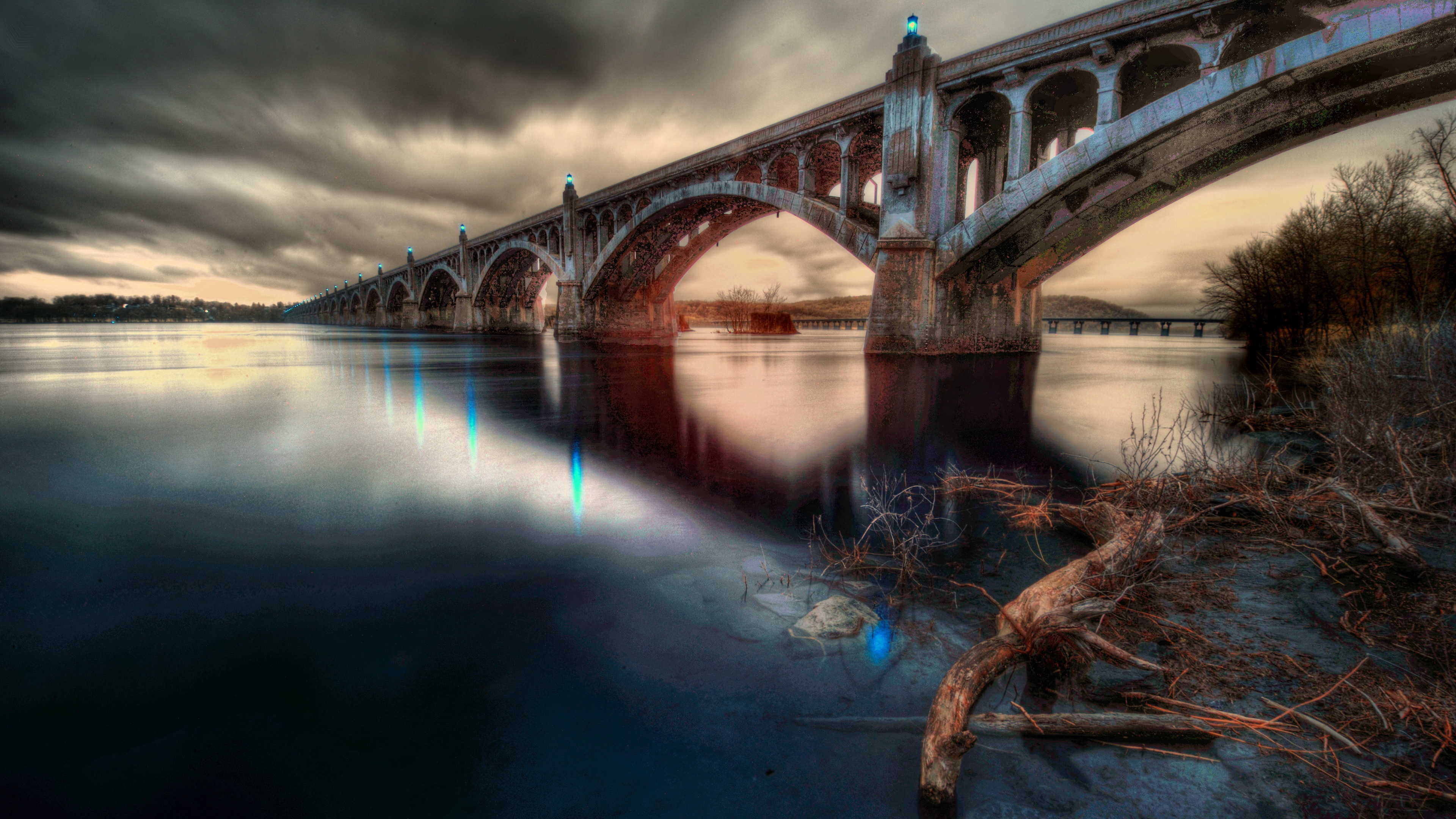 Bridge over river with dramatic clouds HD Wallpaper
