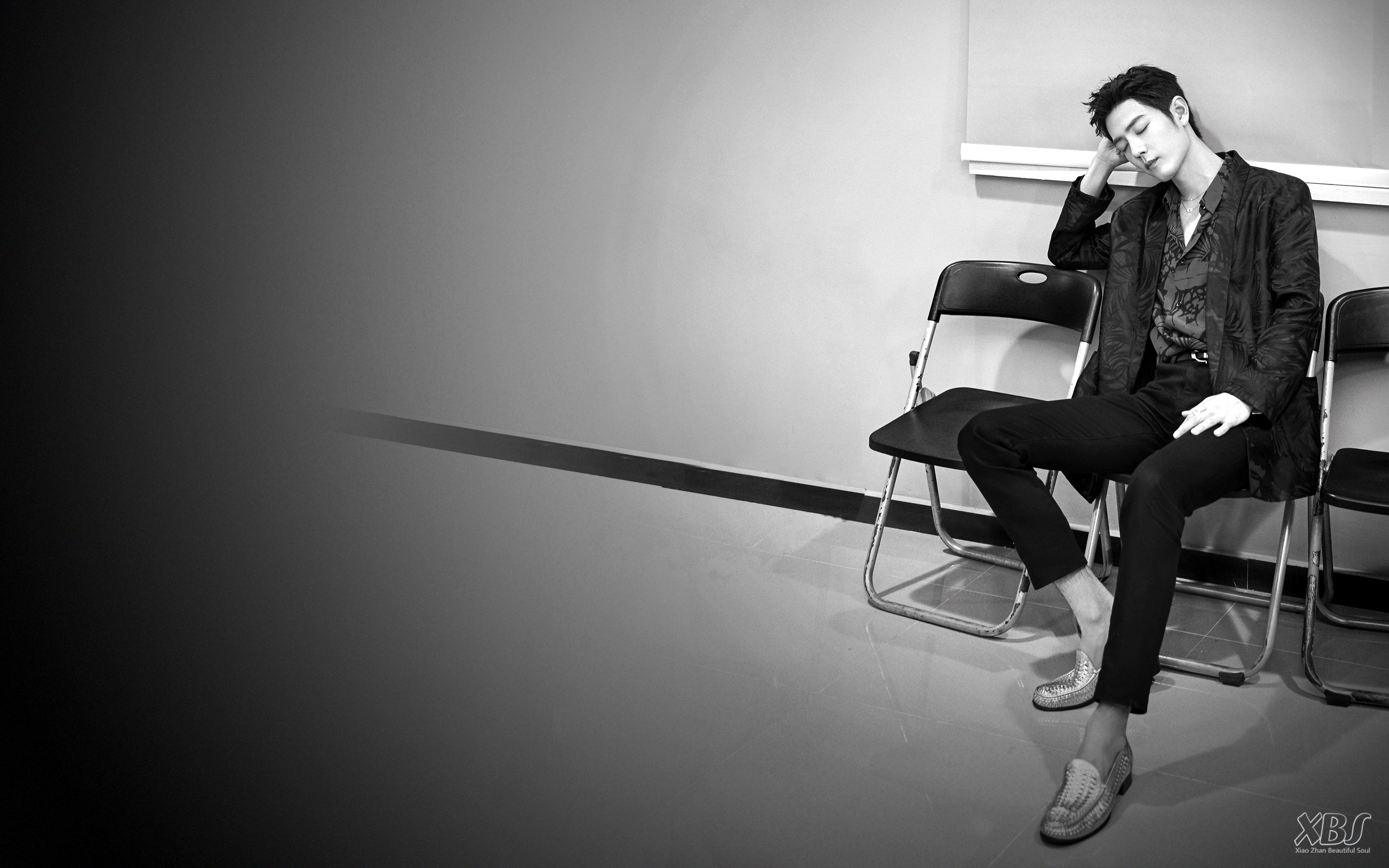 Xiao Zhan sitting on a chair HD Wallpaper