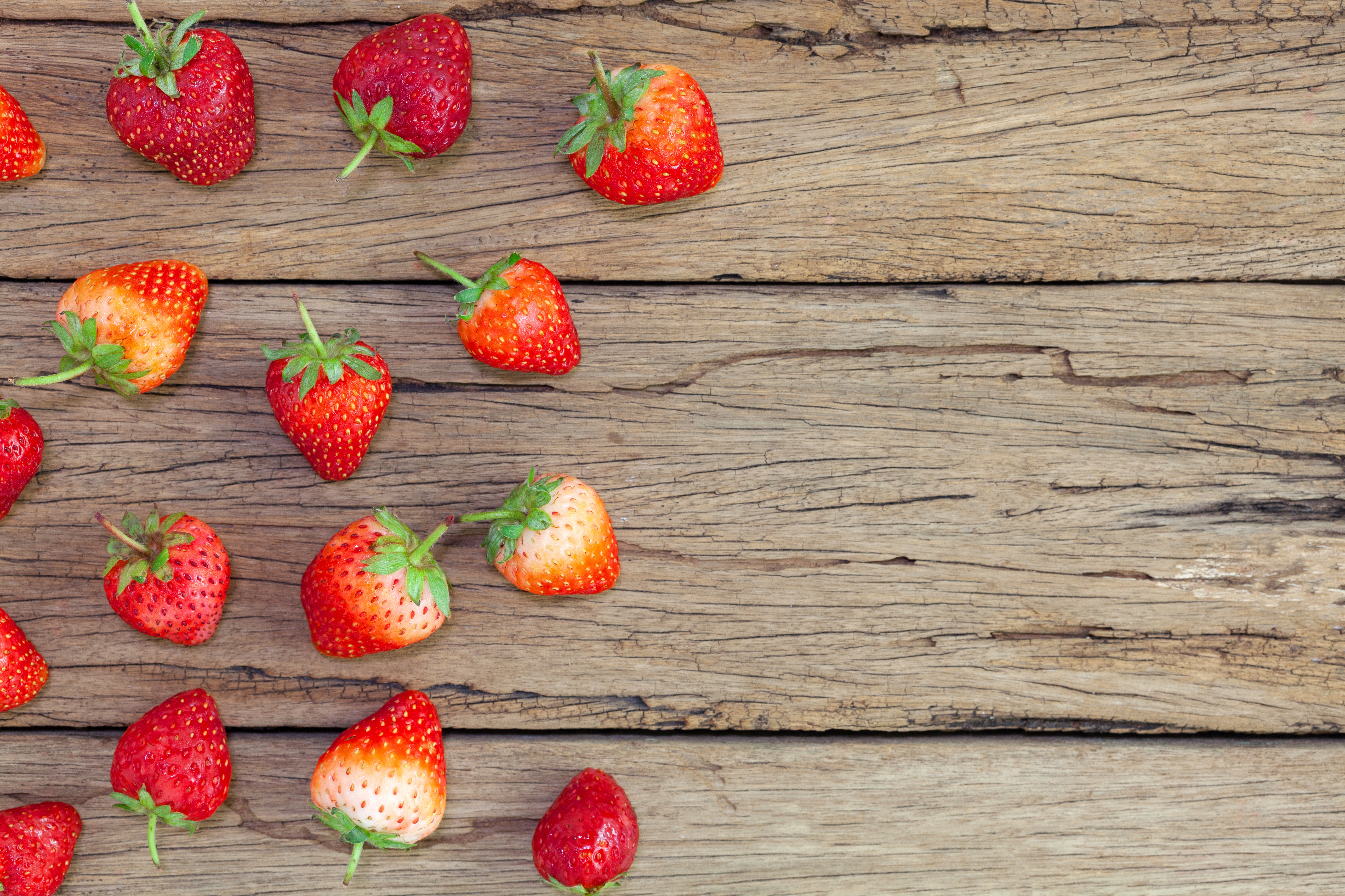 Strawberries on a wooden surface HD Wallpaper