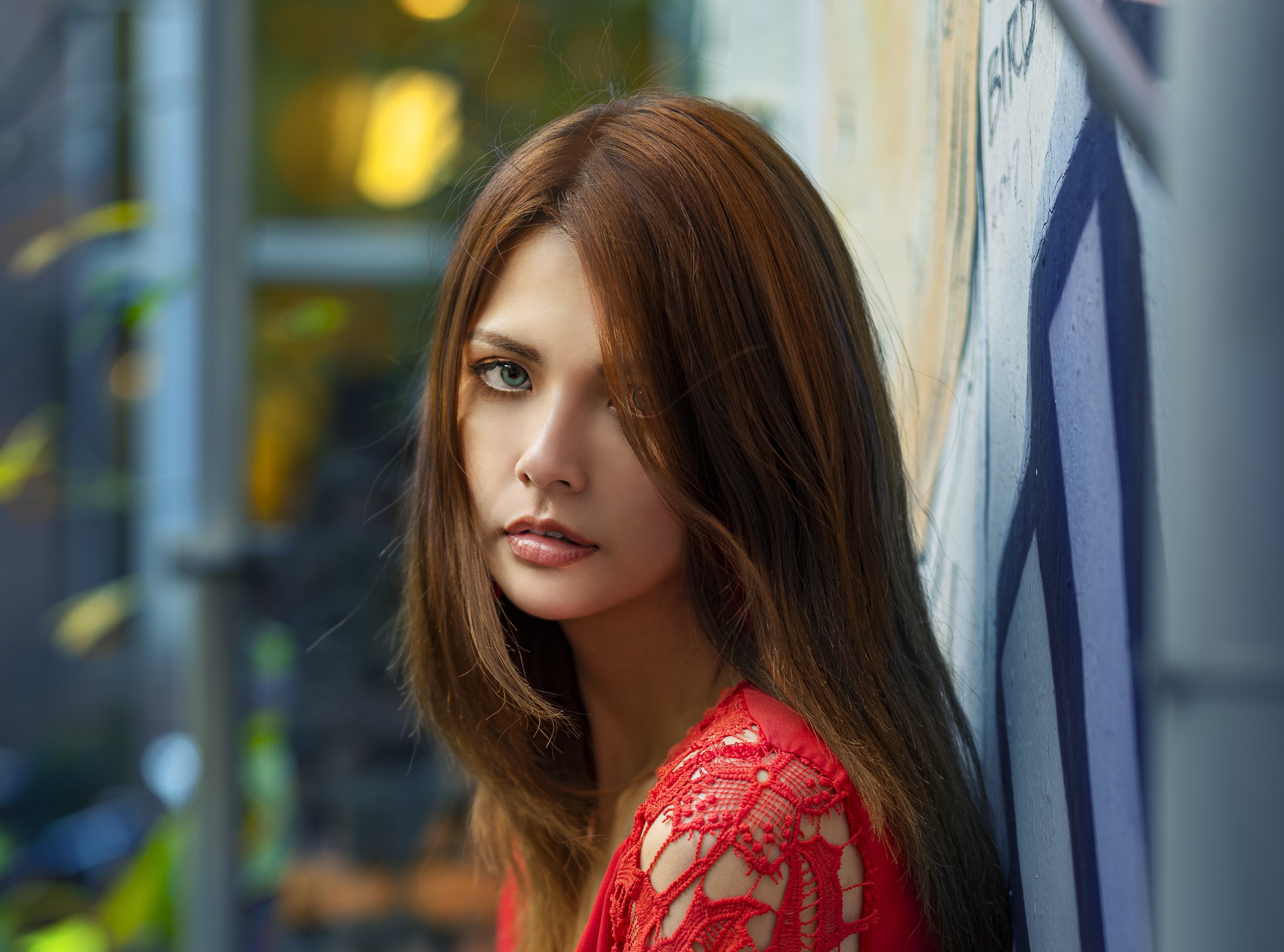 Woman in red lace dress leaning against graffiti wall HD Wallpaper