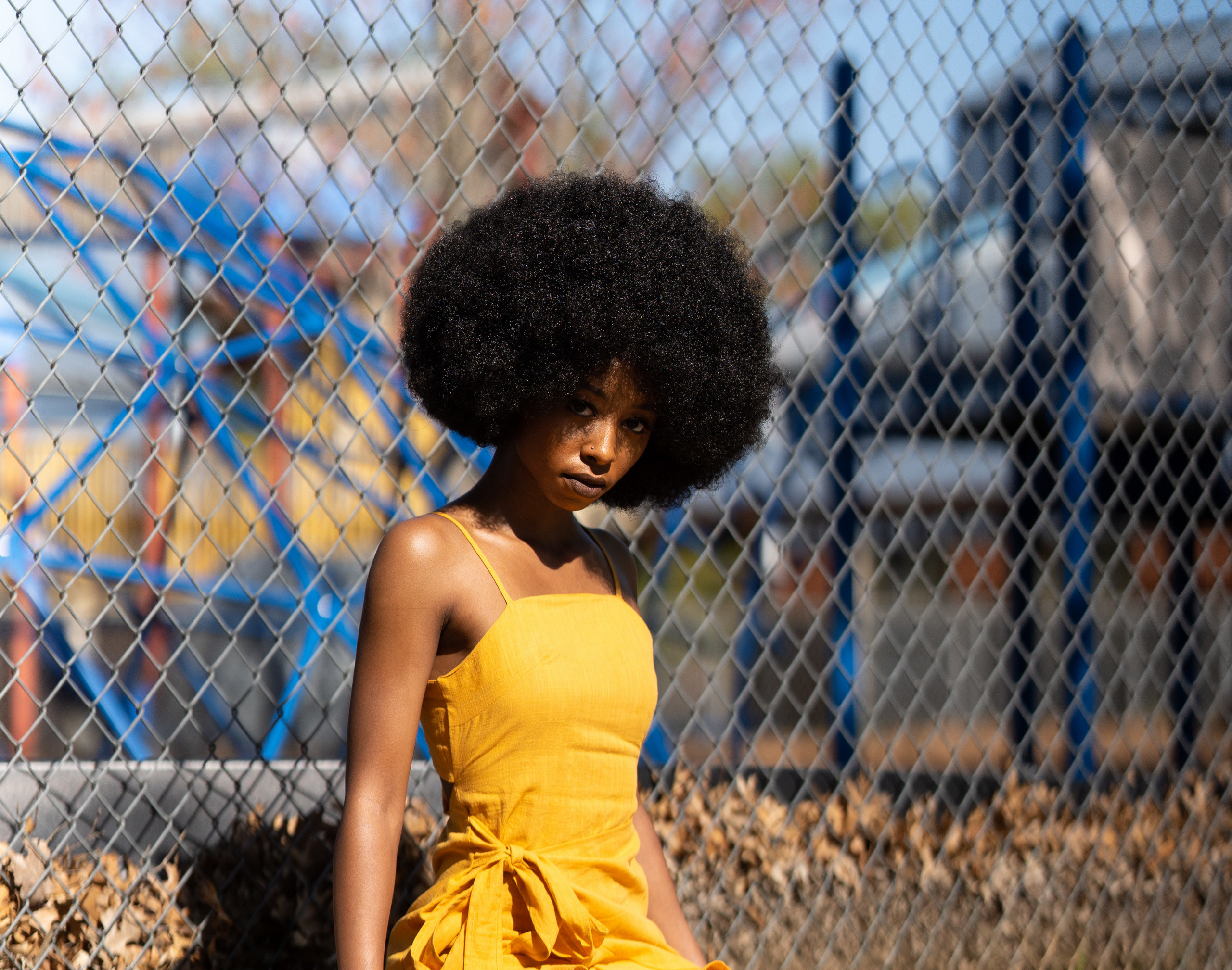 Woman with afro and yellow dress HD Wallpaper