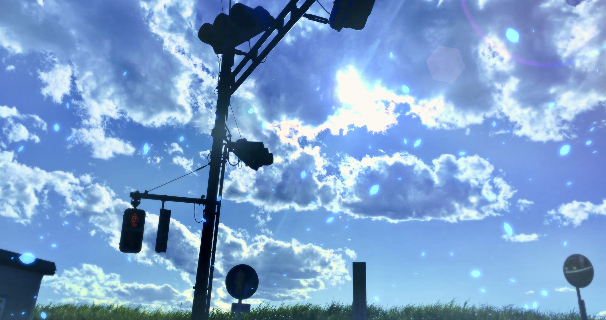 Traffic light against a cloudy sky with sun HD Wallpaper