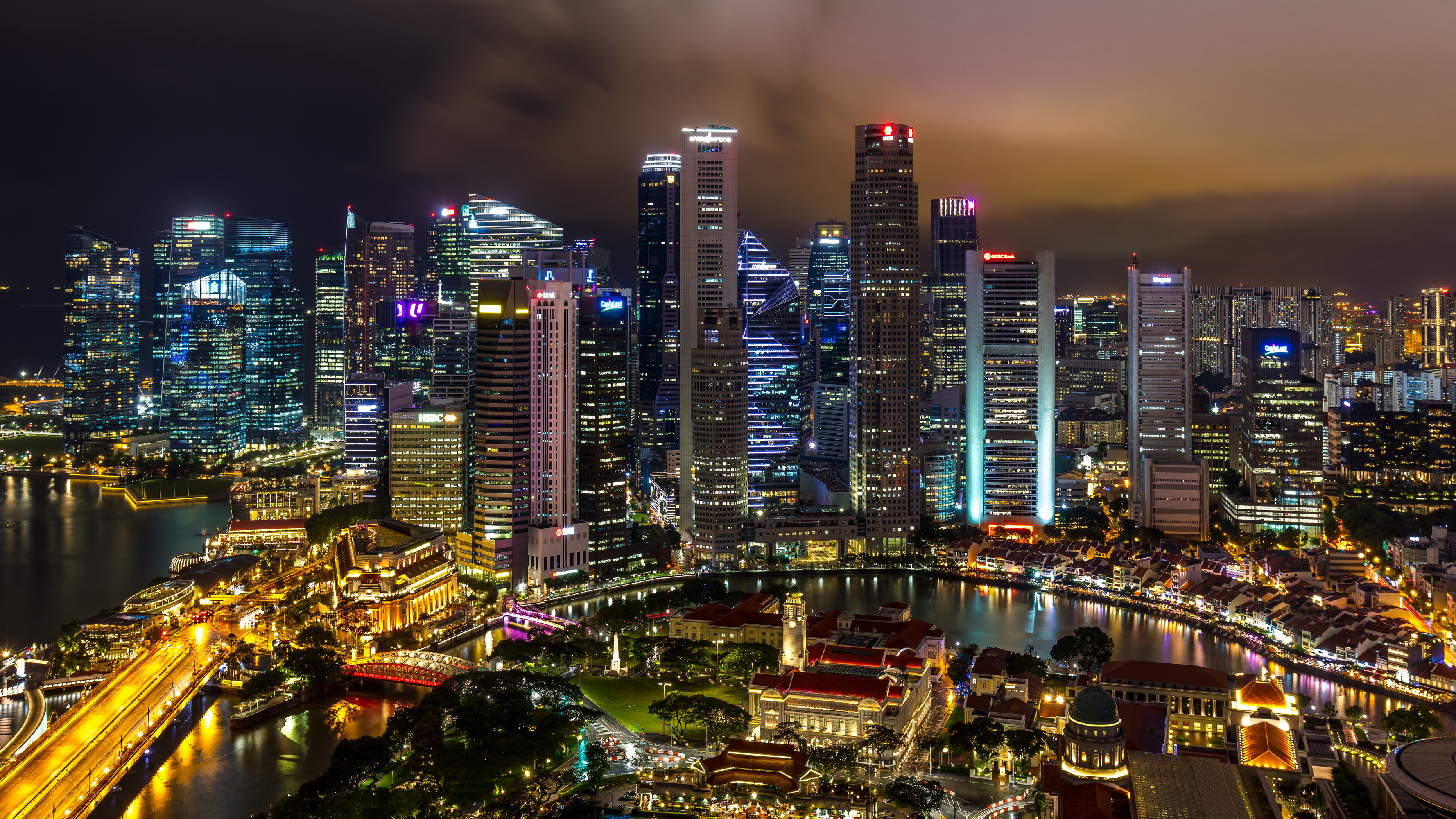 Singapore skyline at night with illuminated skyscrapers HD Wallpaper