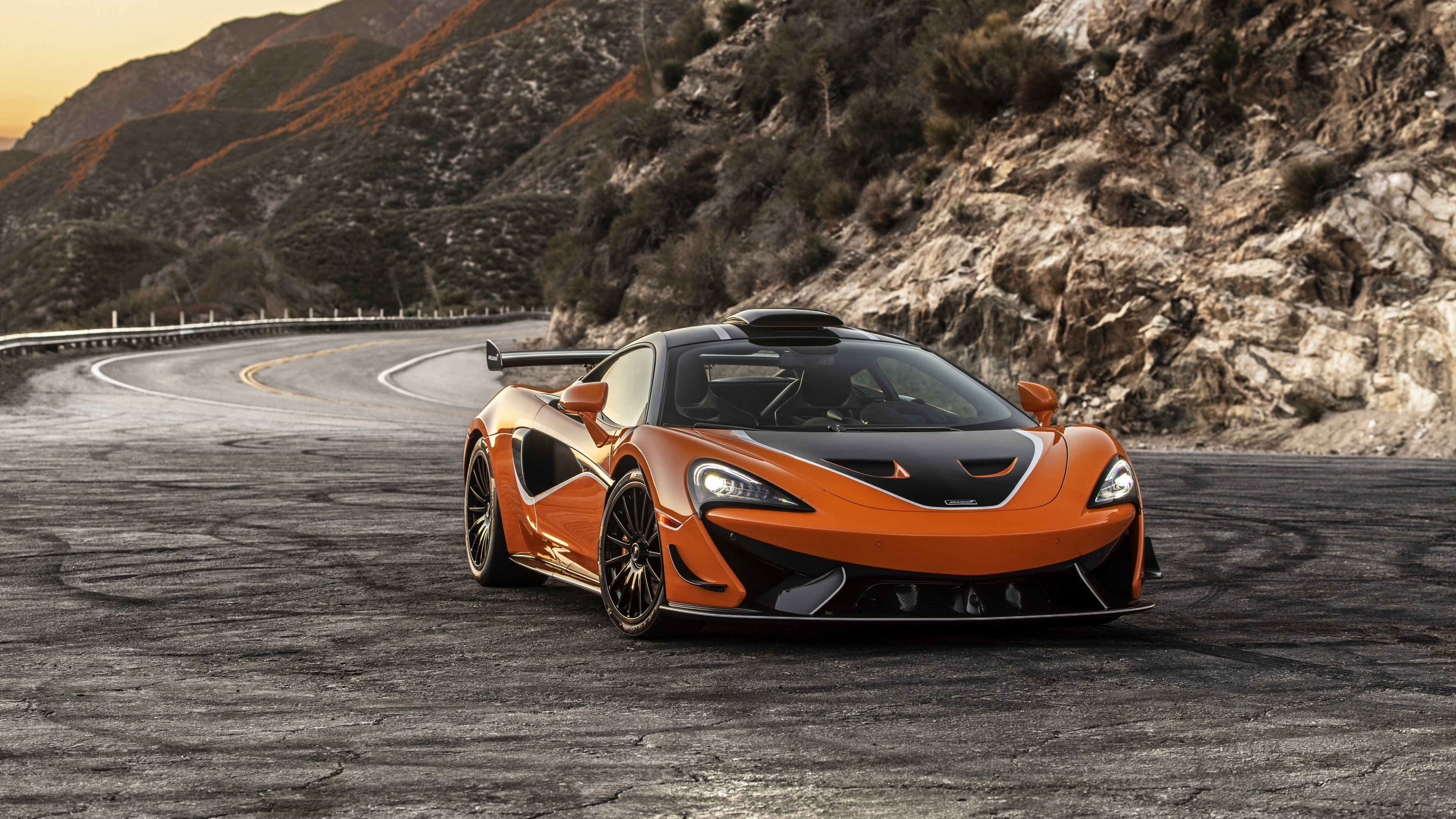 Orange McLaren 620R 4K on a Mountain Road HD Wallpaper
