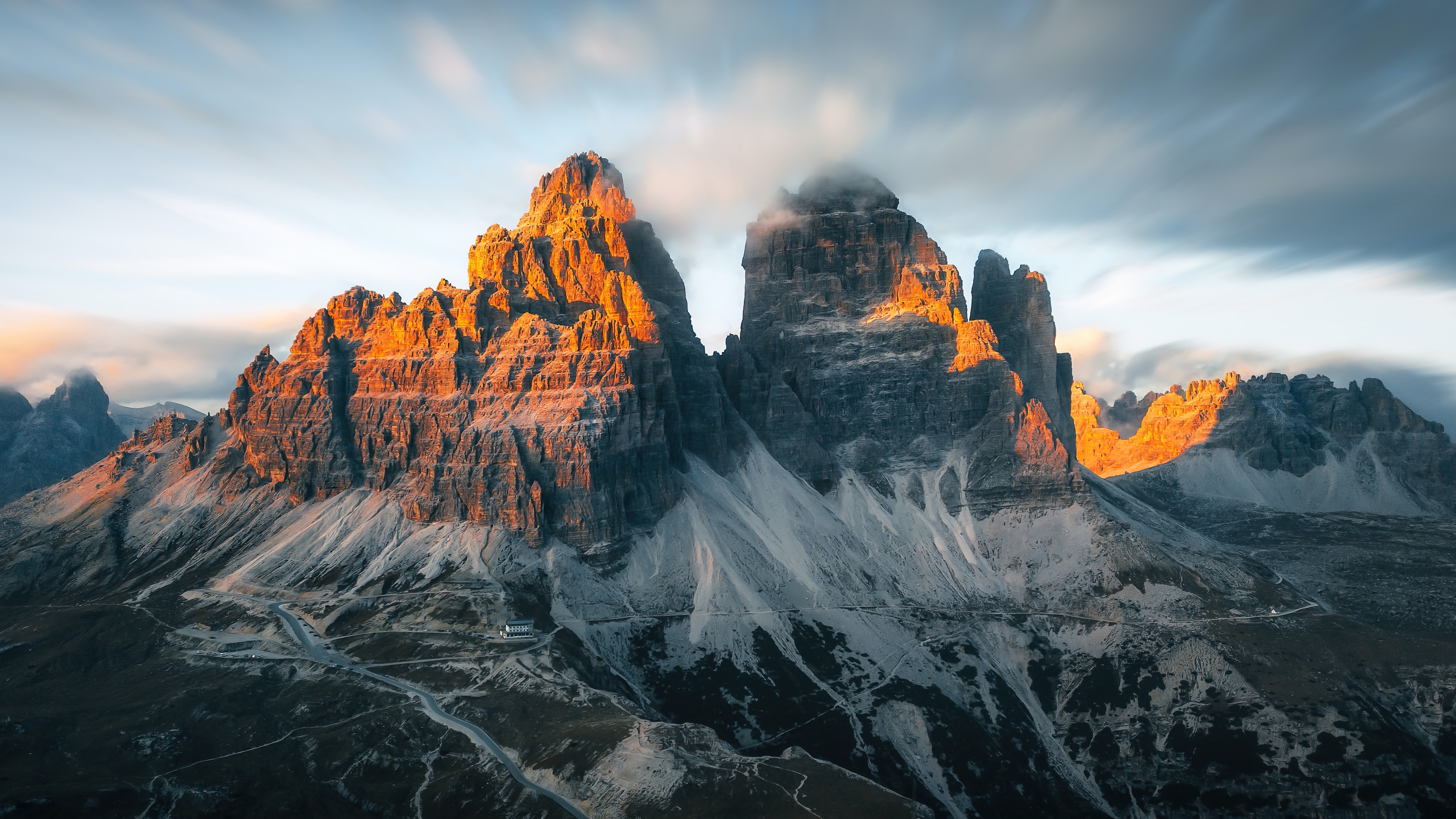 Tre Cime di Lavaredo mountains in Italy at sunset 4K HD Wallpaper