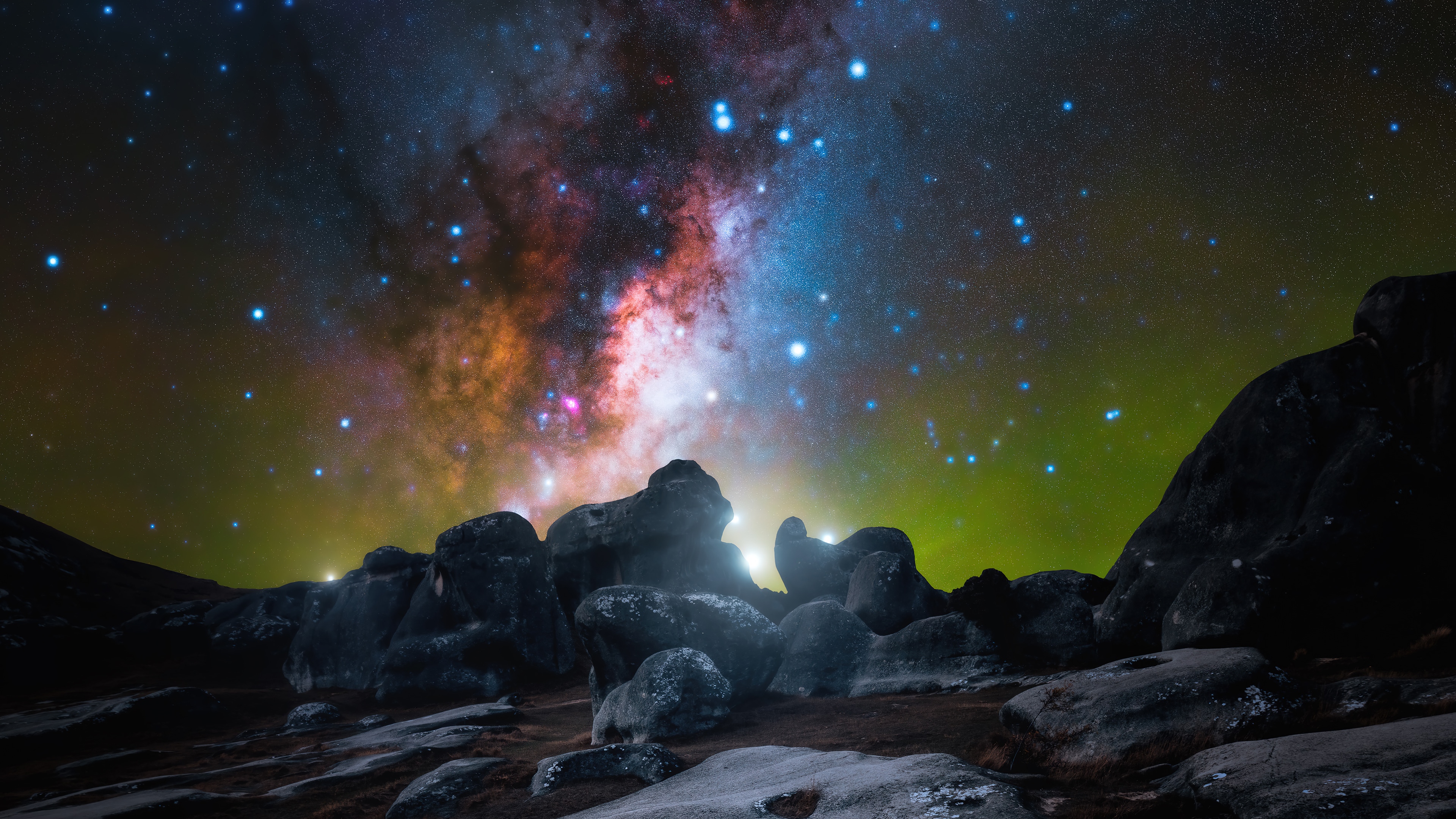 Starry Night Sky Over Rocky Landscape 4K HD Wallpaper