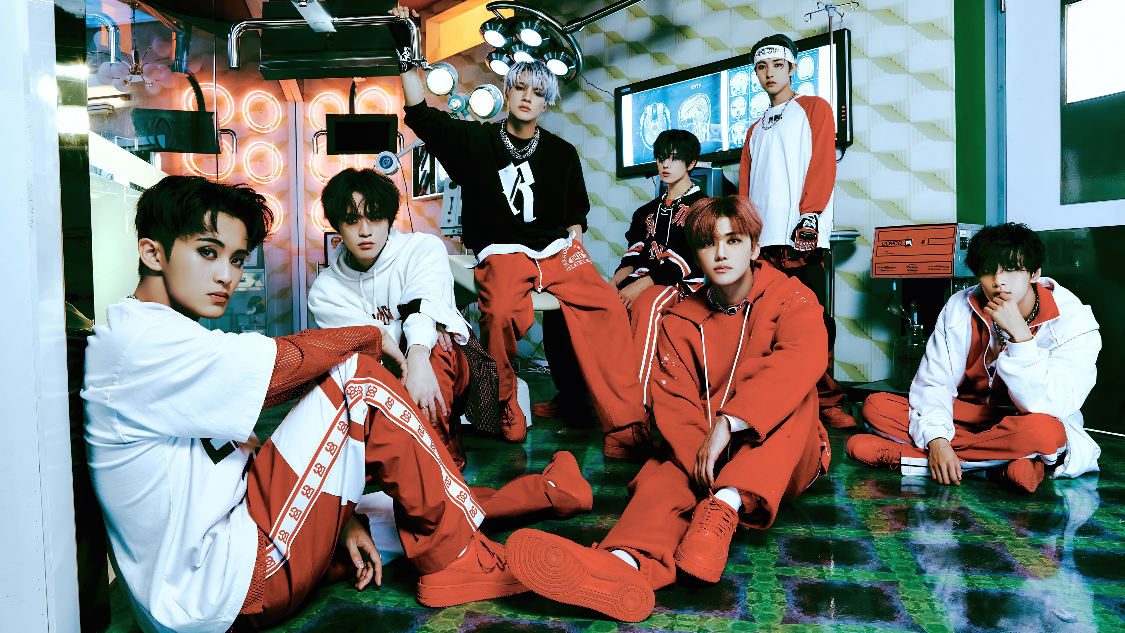 NCT DREAM members in a futuristic medical setting HD Wallpaper