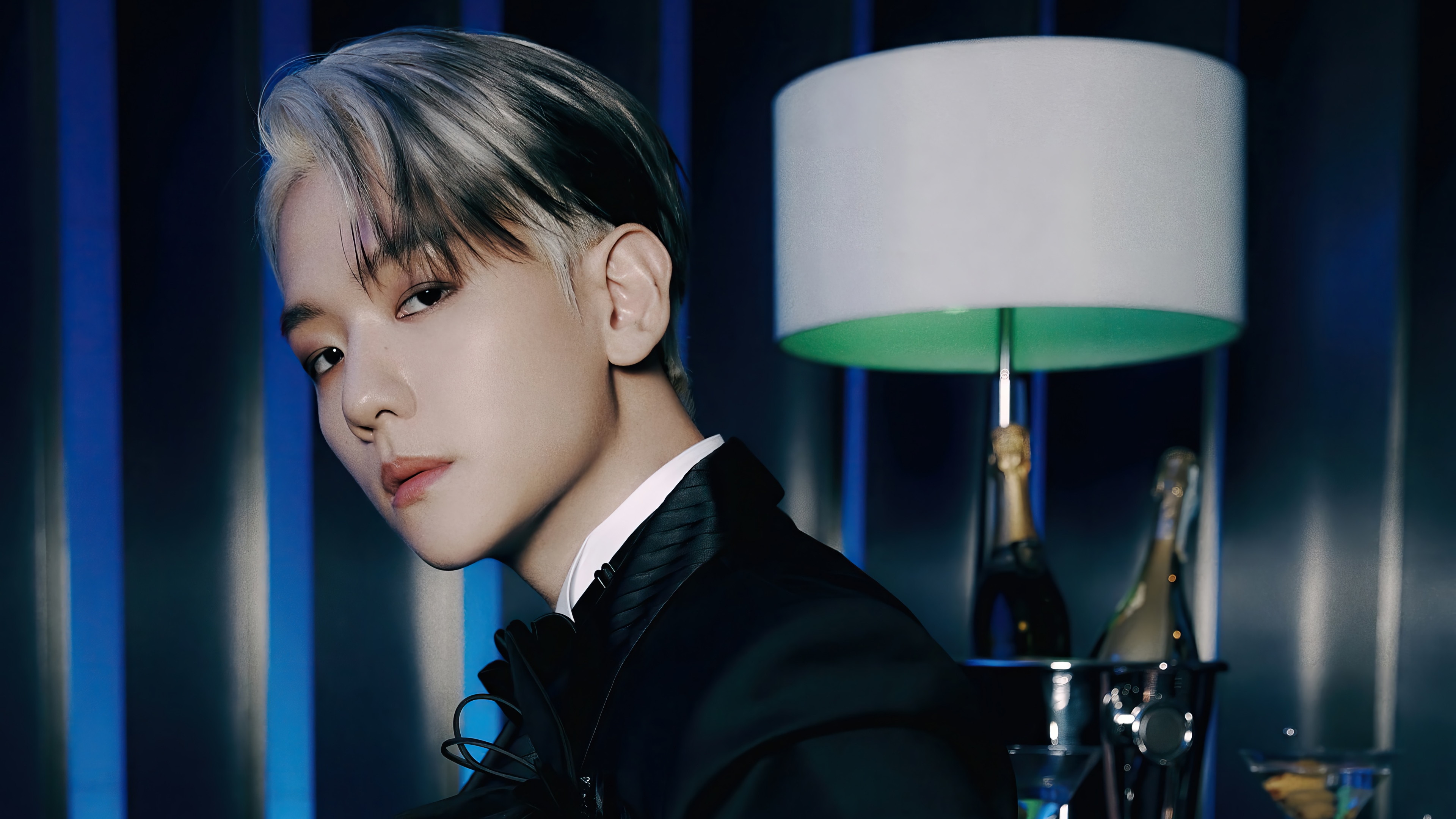 Baekhyun in a black suit with champagne bottles HD Wallpaper