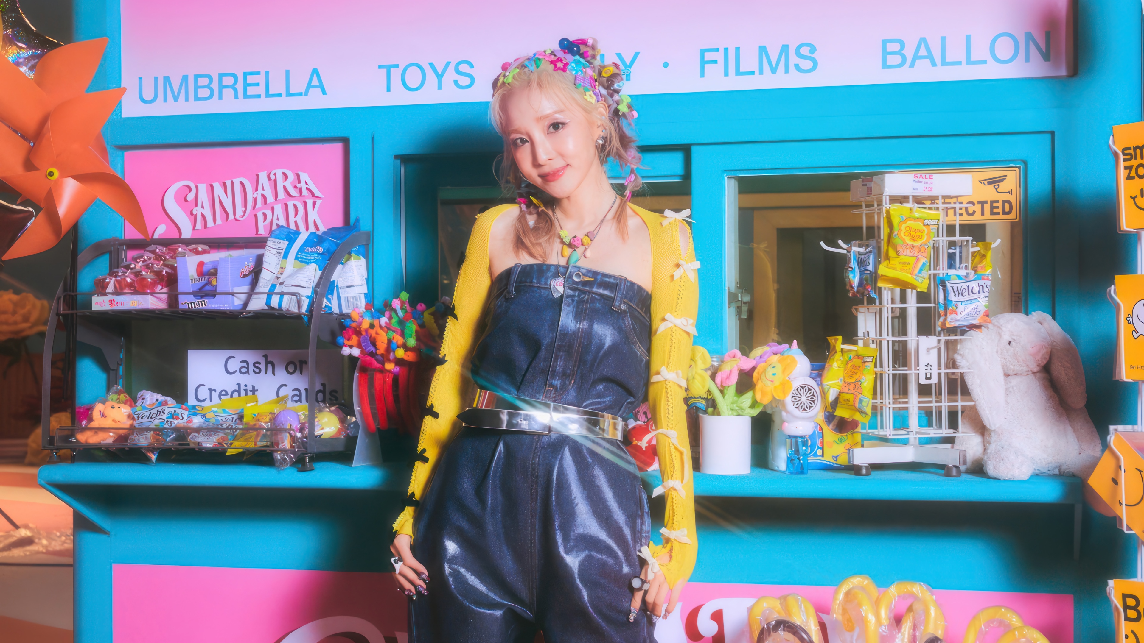 Sandara Park in a colorful candy store setting HD Wallpaper