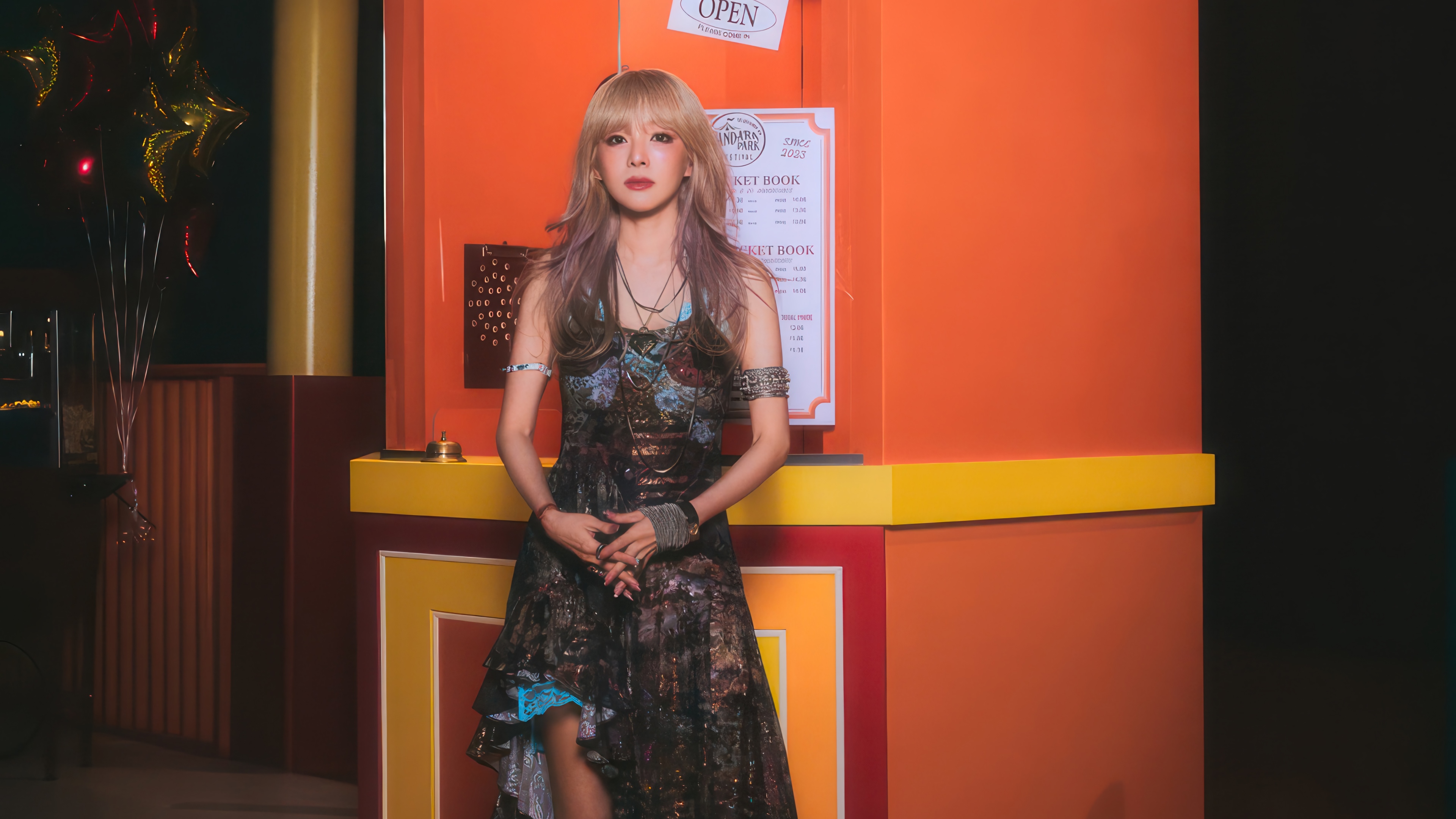 Sandara Park in a colorful amusement park setting HD Wallpaper