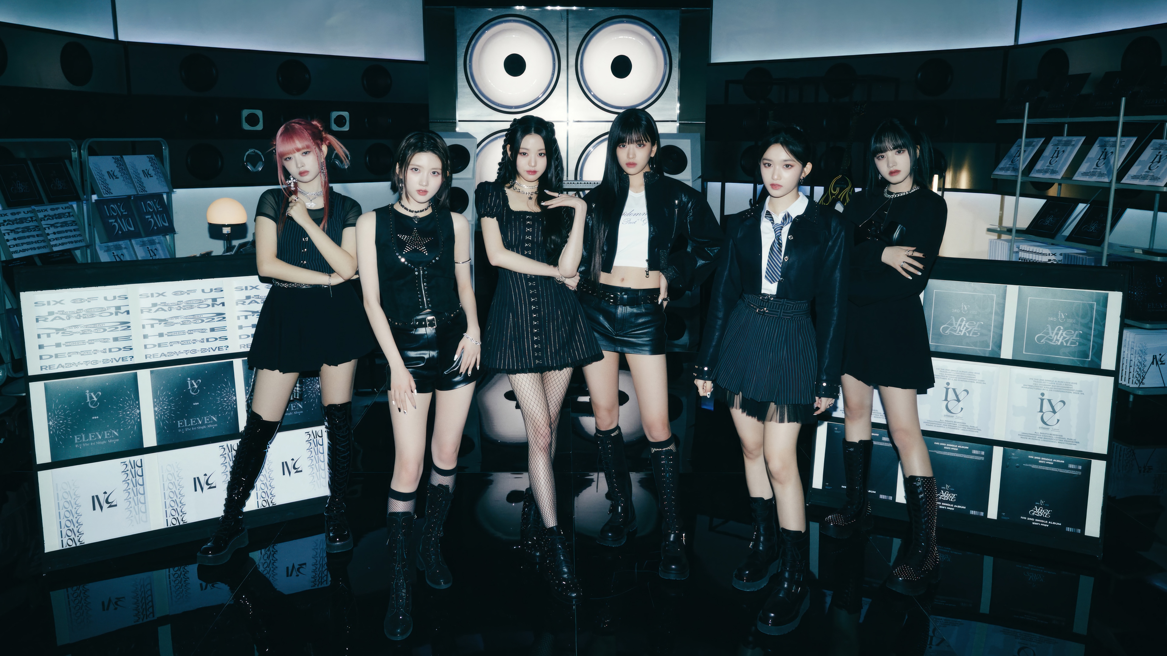 IVE members posing in a studio setting HD Wallpaper