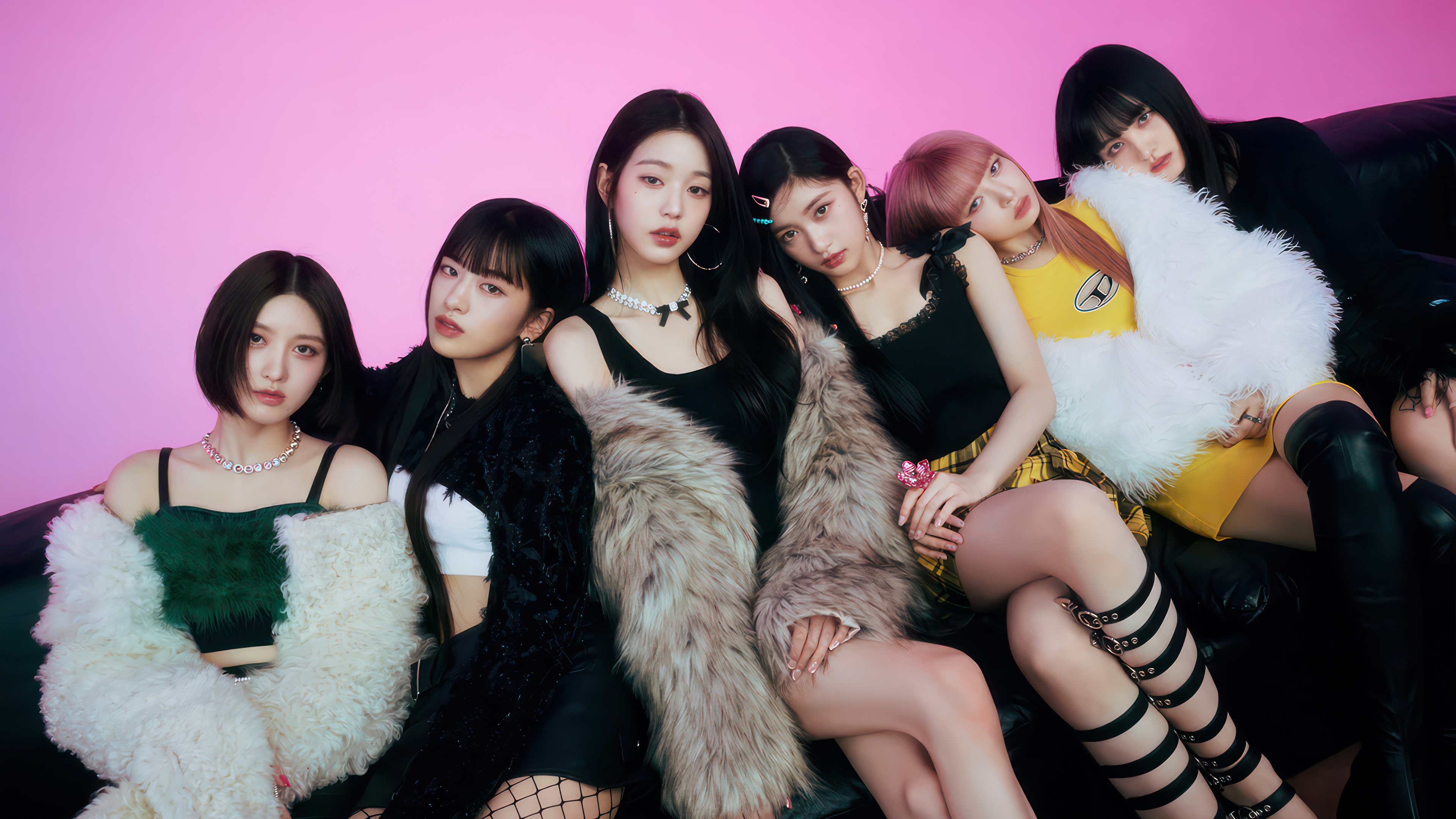IVE members posing on a black couch HD Wallpaper