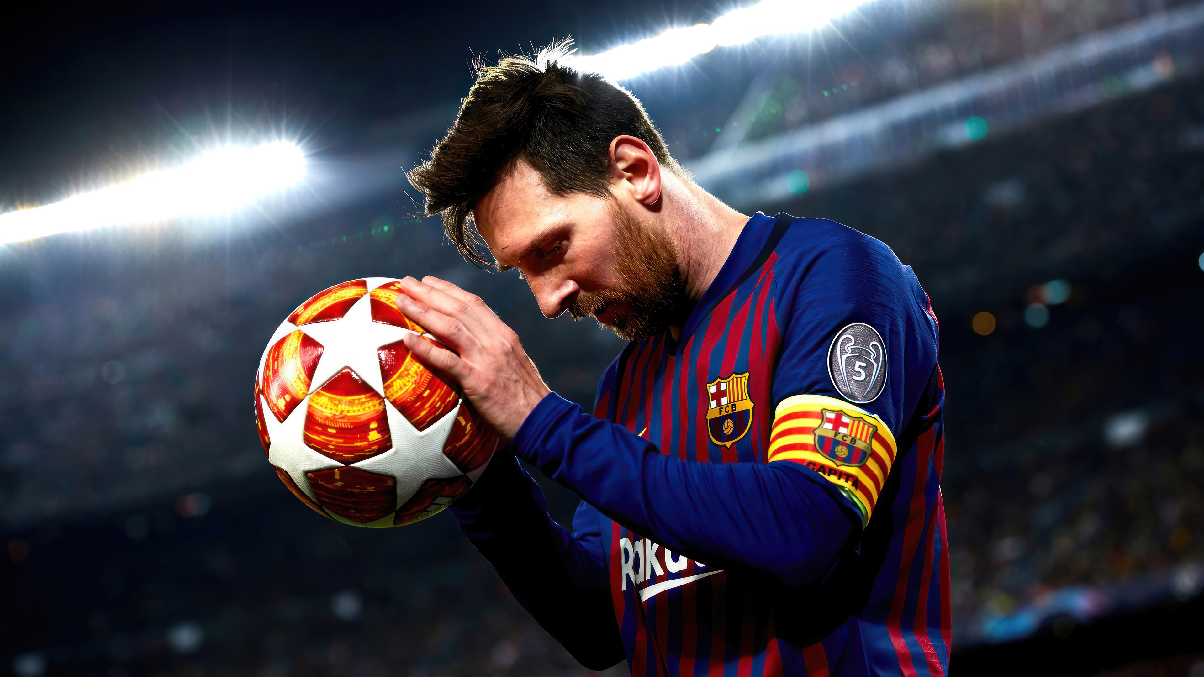 Lionel Messi holding a football HD Wallpaper